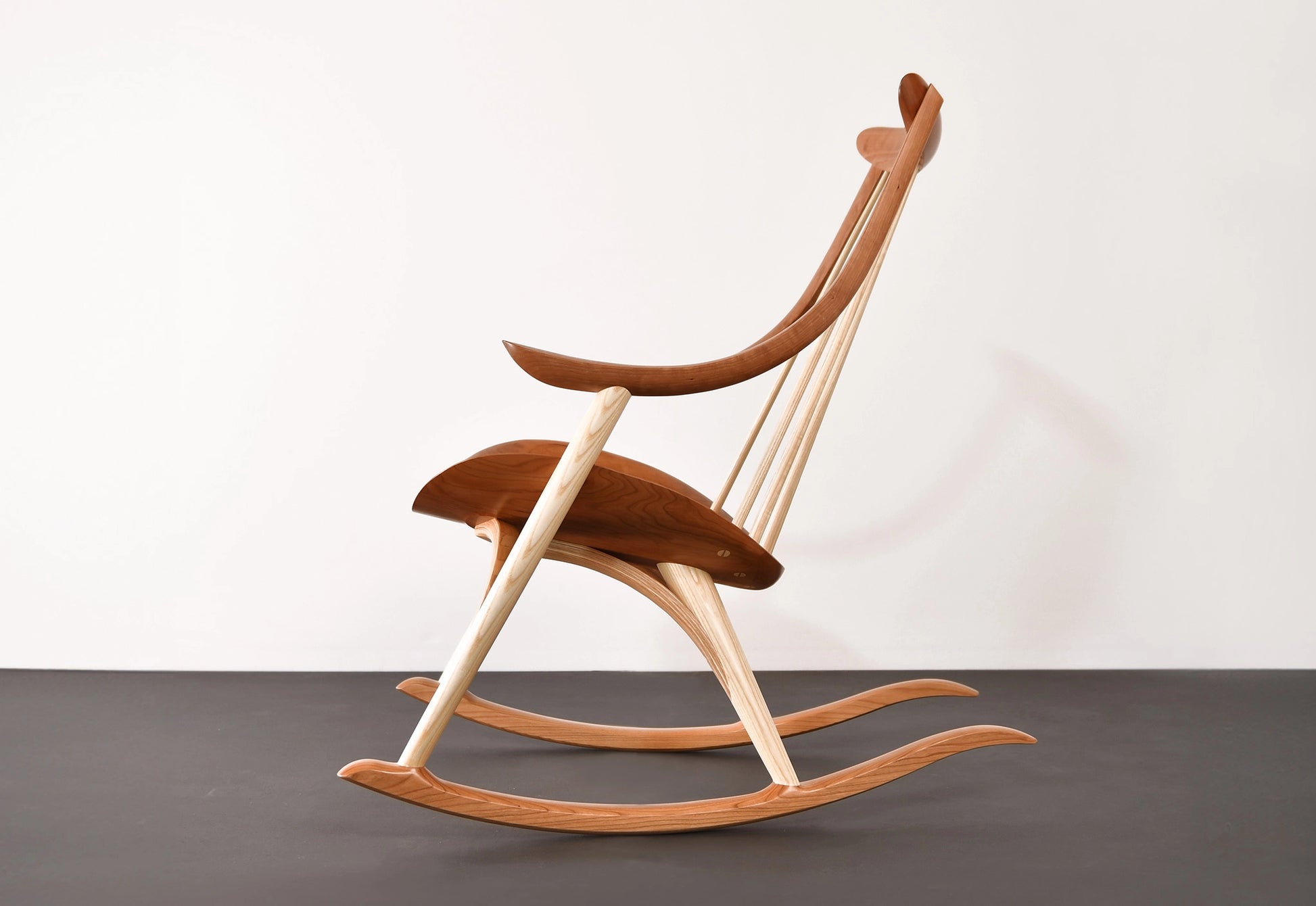 Wooden rocking chair on a plain background