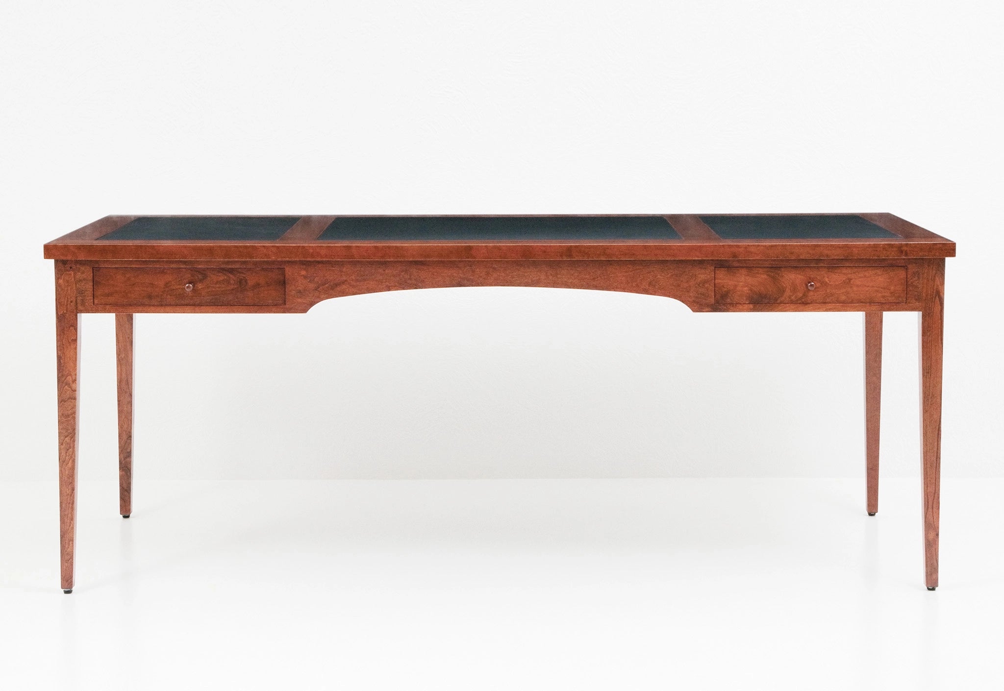 Wooden desk with a black top on a white background