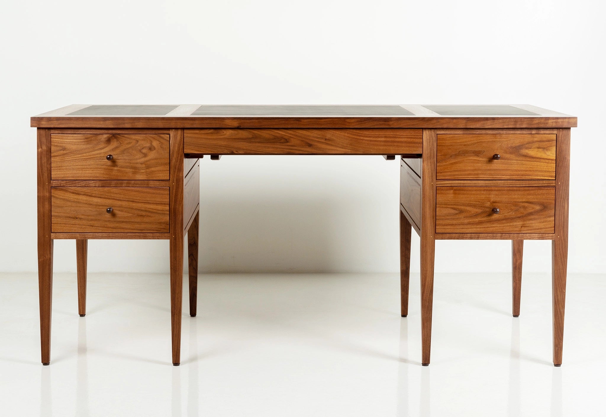 Wooden desk with two drawers on a white background