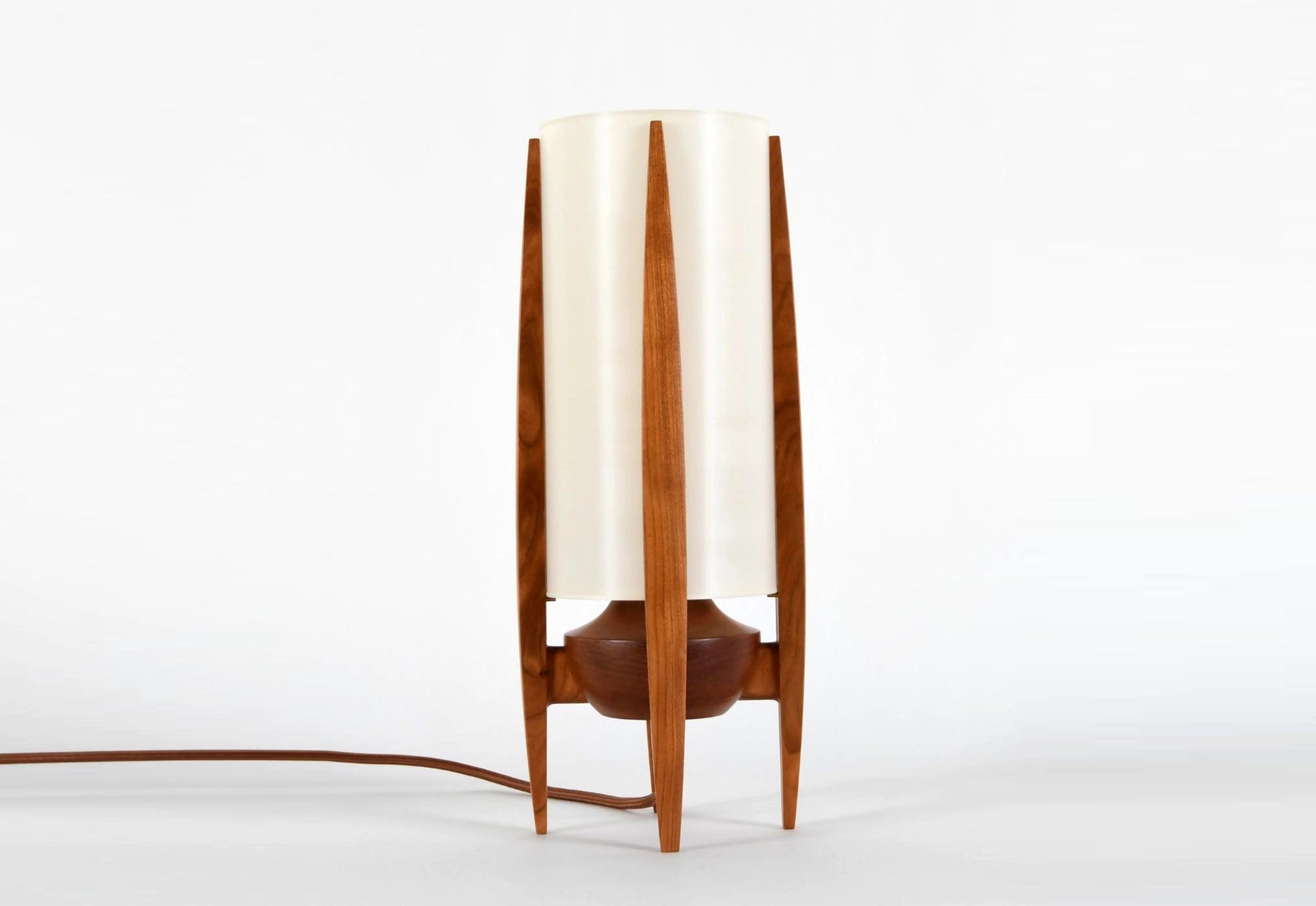 Wooden lamp with a white shade on a white background