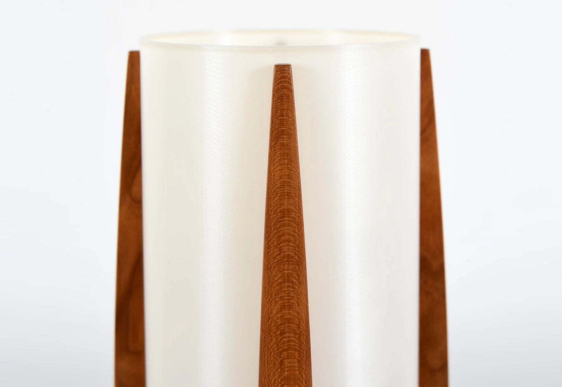 Wooden lamp with a white shade on a white background