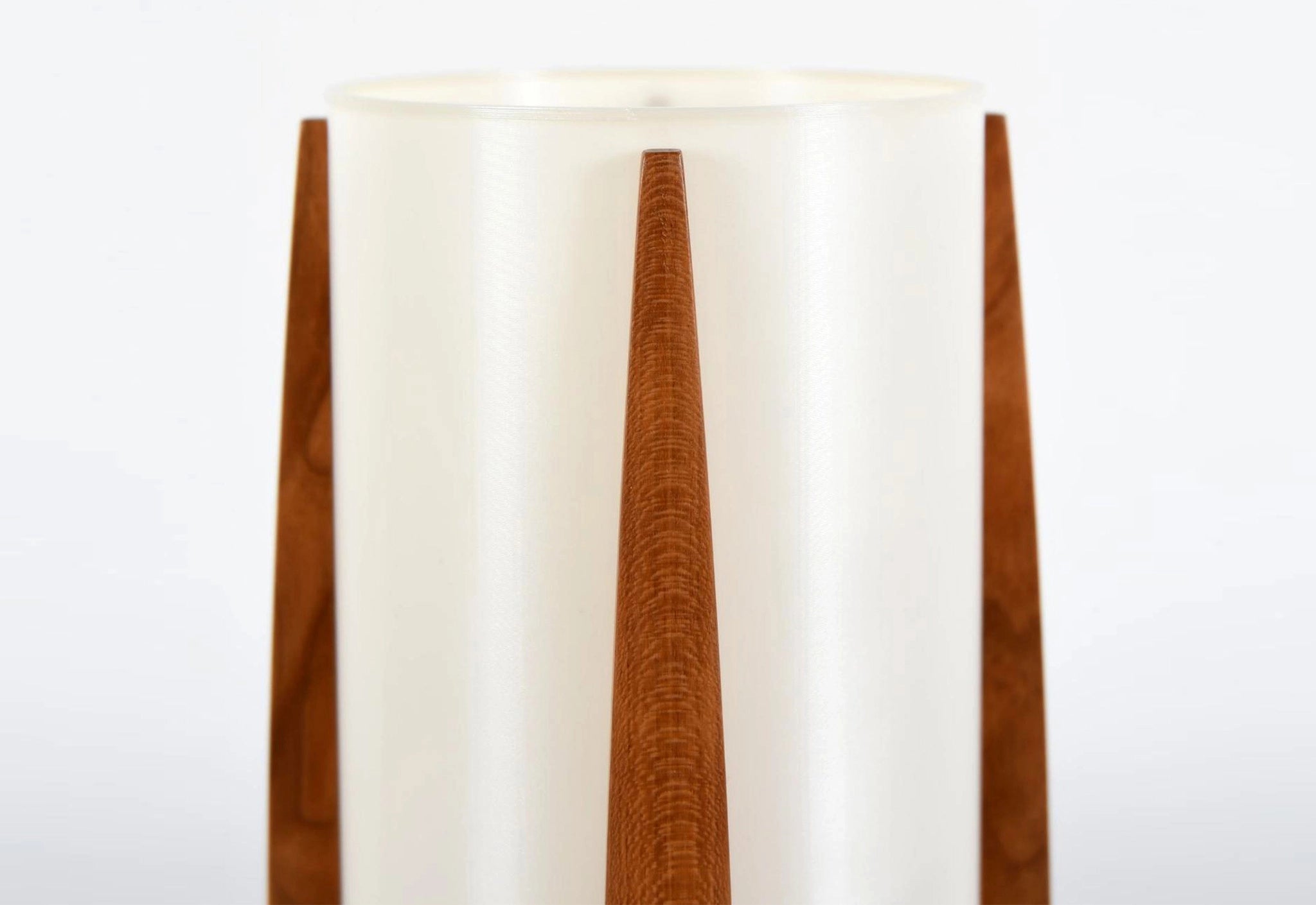 Wooden lamp with a white shade on a white background