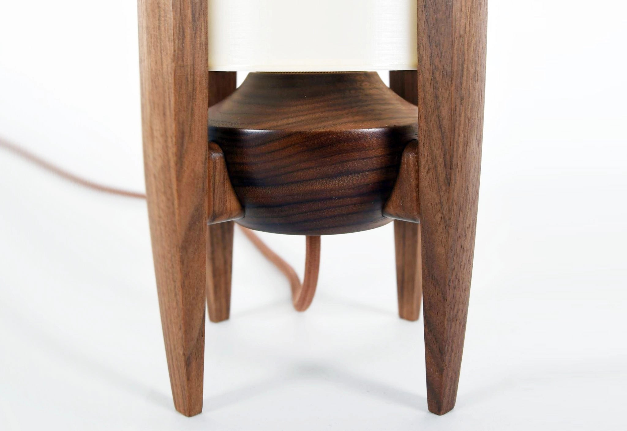 Wooden lamp with a white cushion on a white background