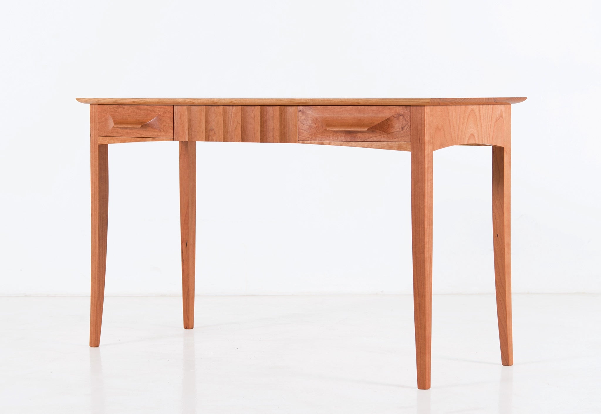 Wooden desk with drawers on a white background