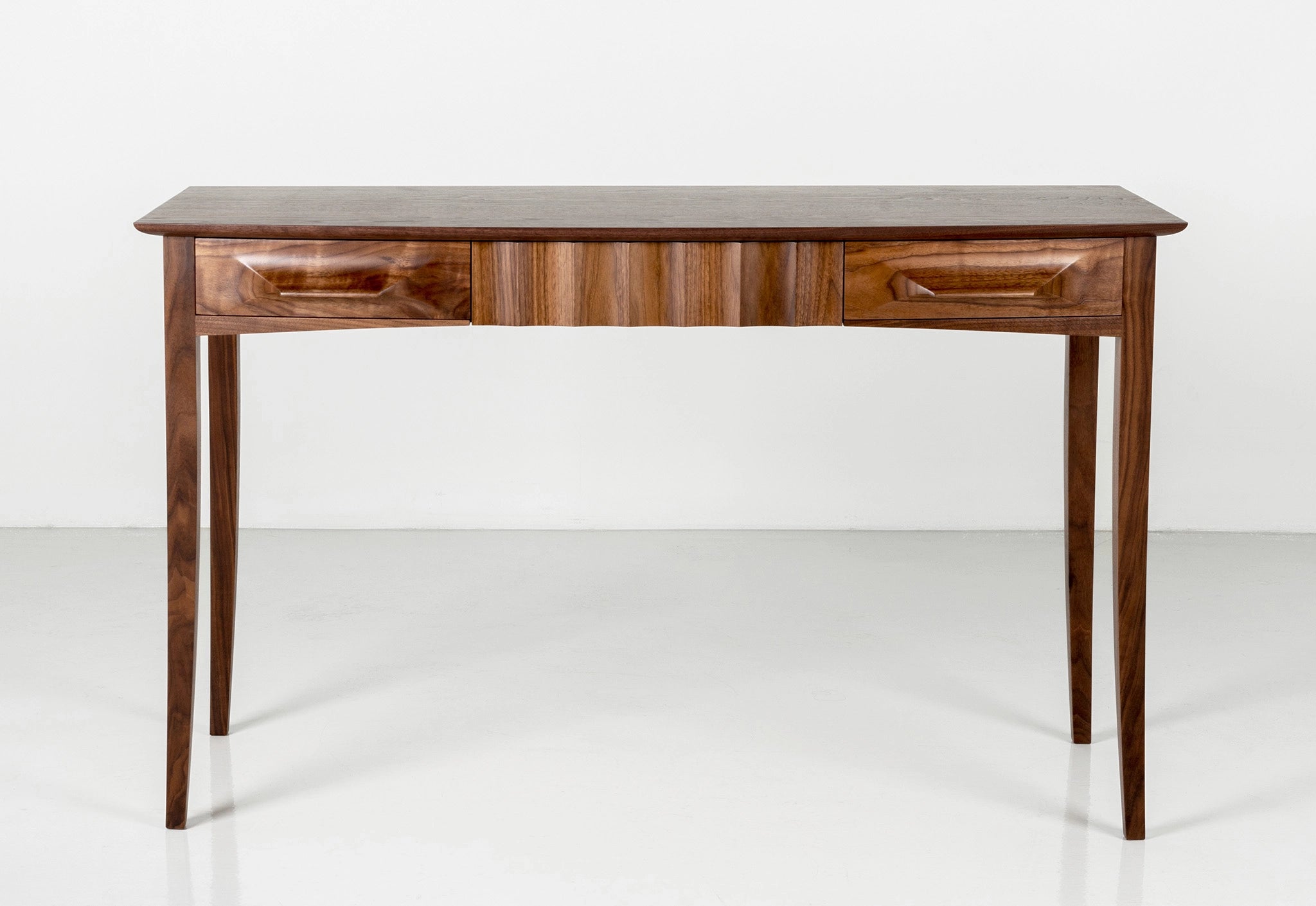 Wooden desk with a dark wood on a white background