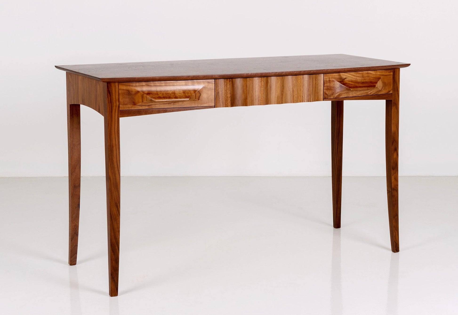 Wooden desk with drawers on a white background