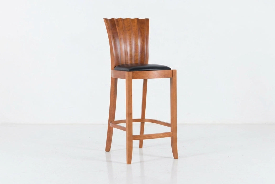 Wooden bar stool with black seat on a white background
