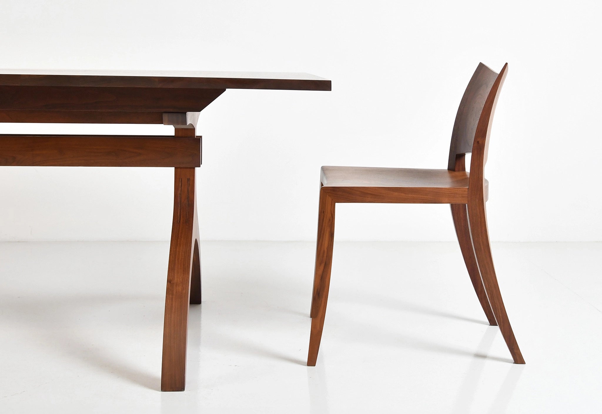 Wooden dining table and chair on a white background