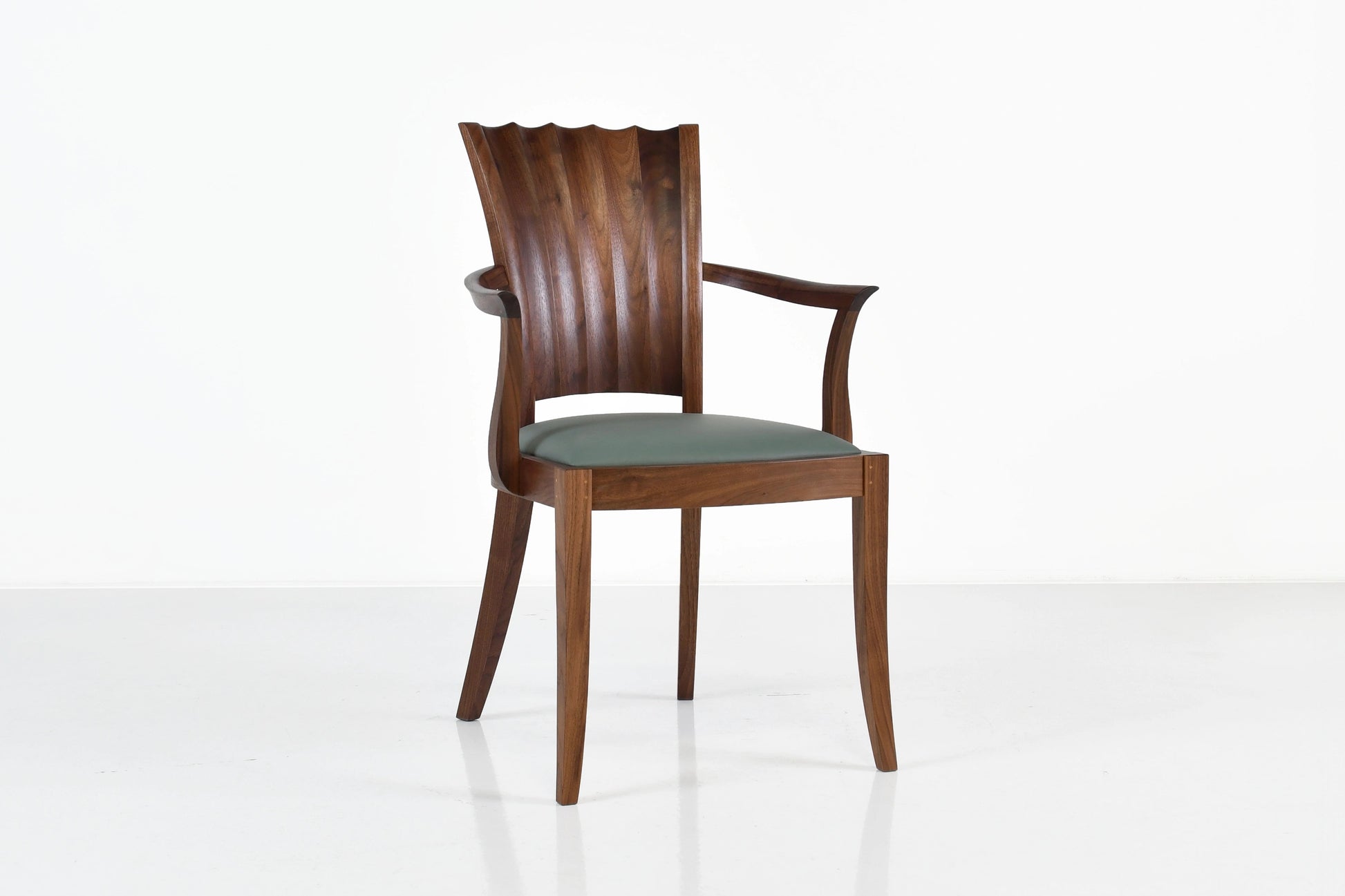 Wooden chair with a gray cushion on a white background
