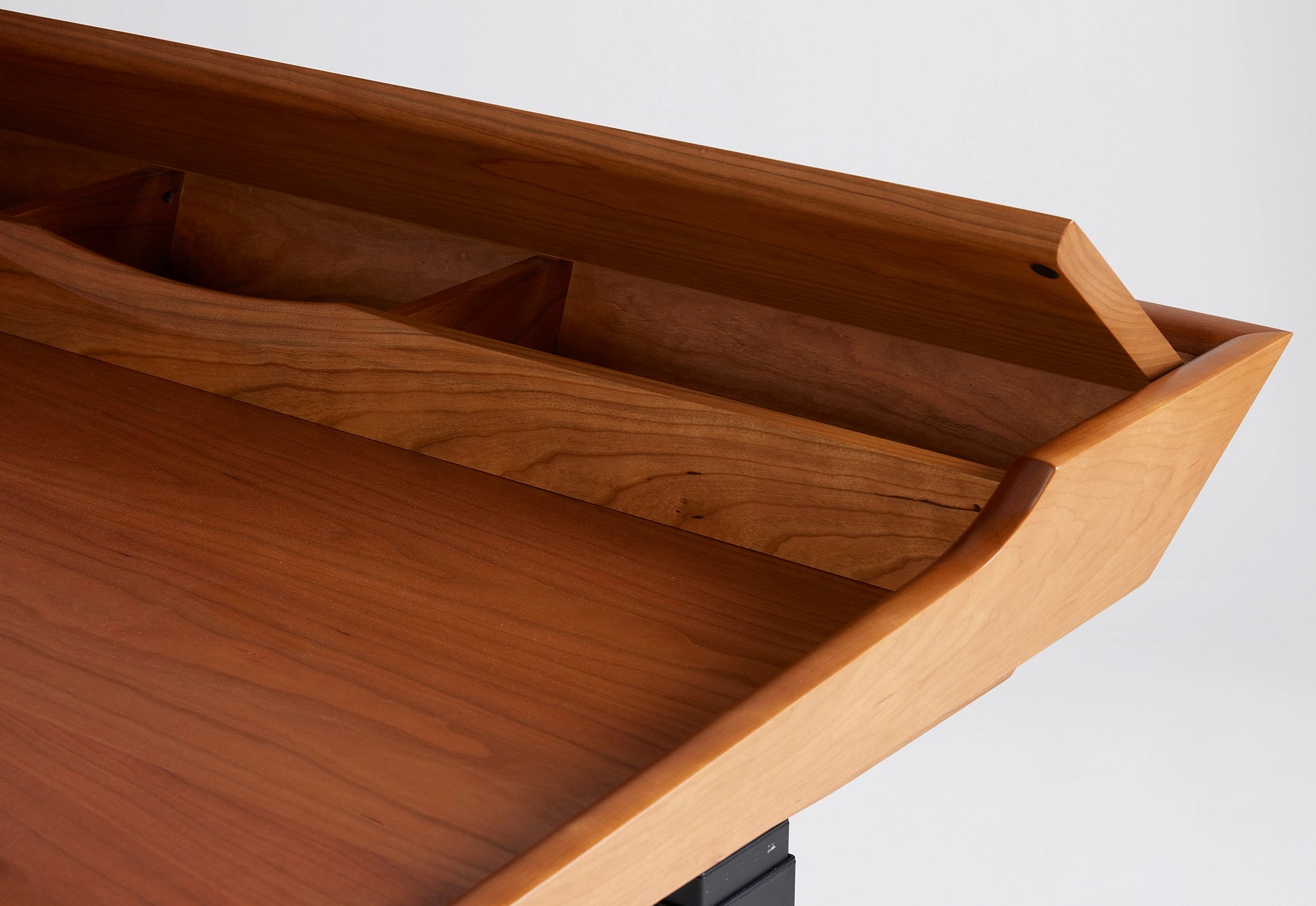Wooden desk with compartments on a white background