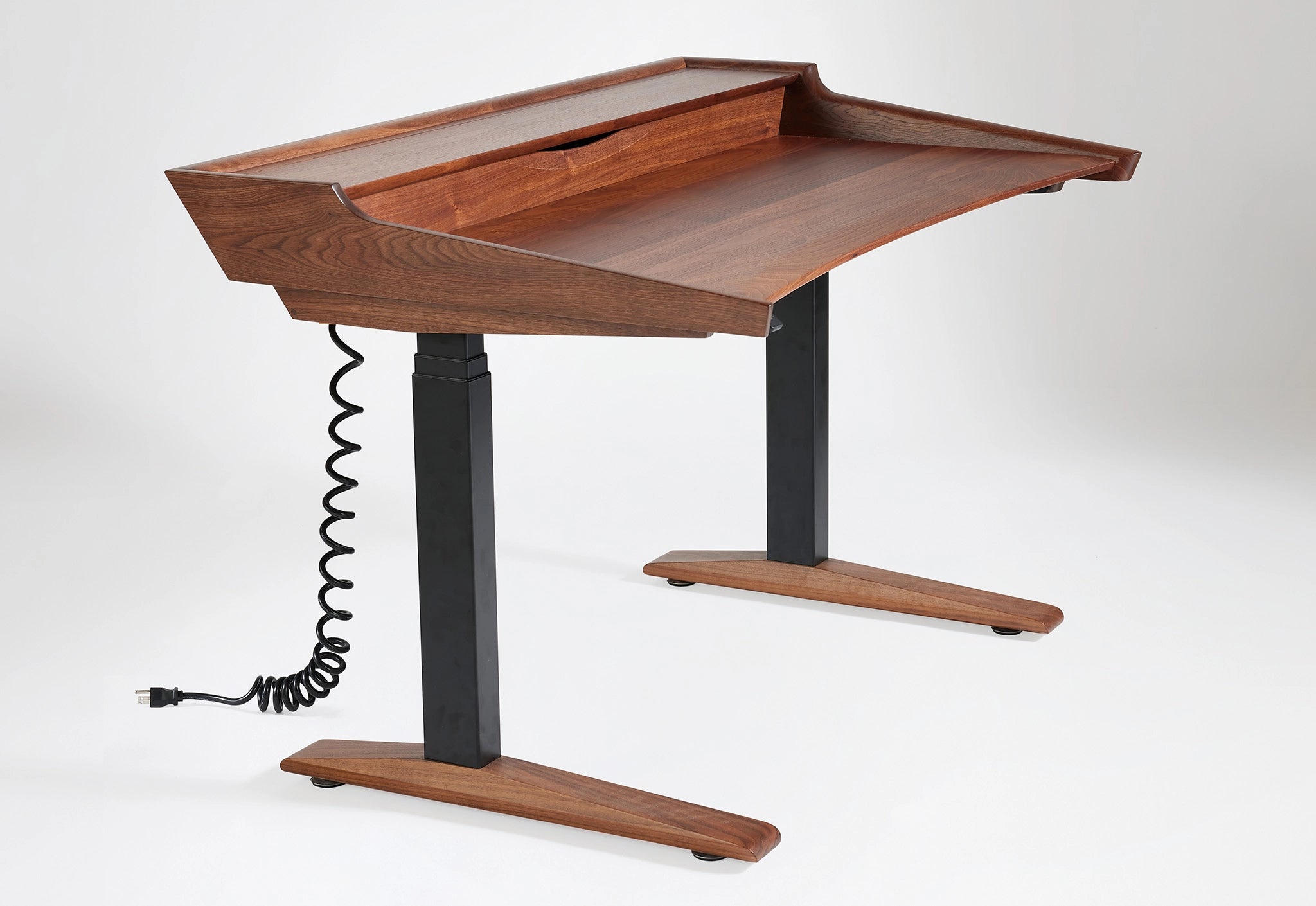 Wooden adjustable desk with black legs on a white background