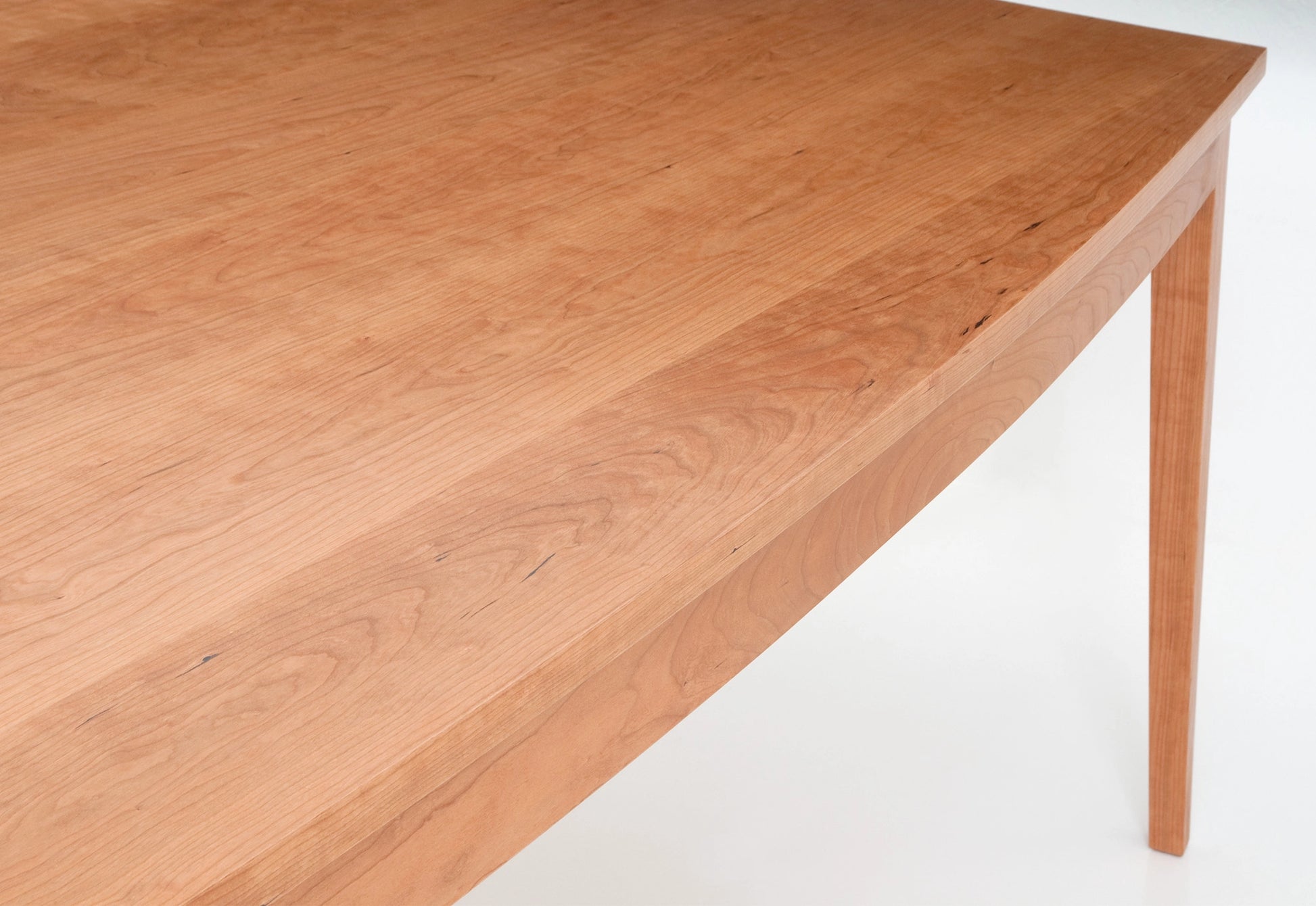 Wooden table surface on a white background