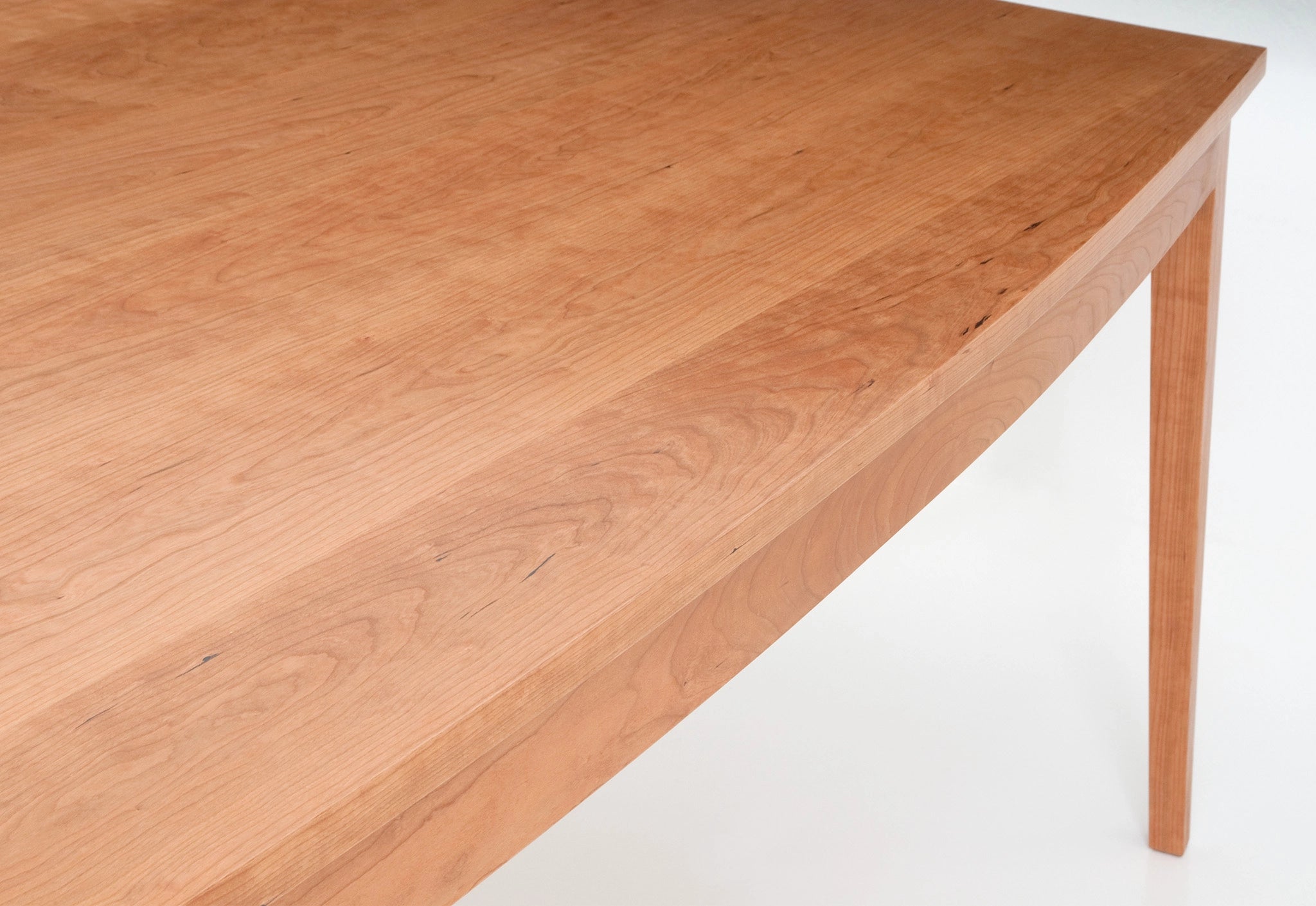 Wooden table surface on a white background