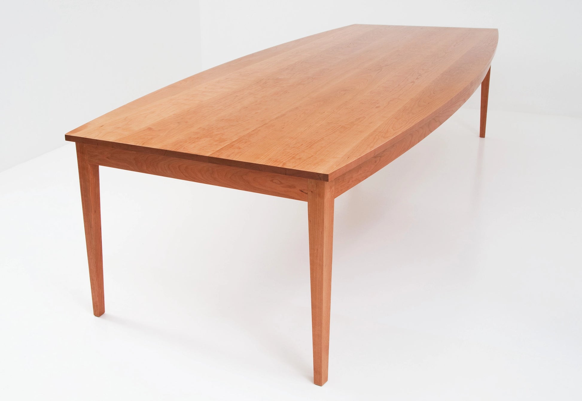 Wooden dining table on a white background