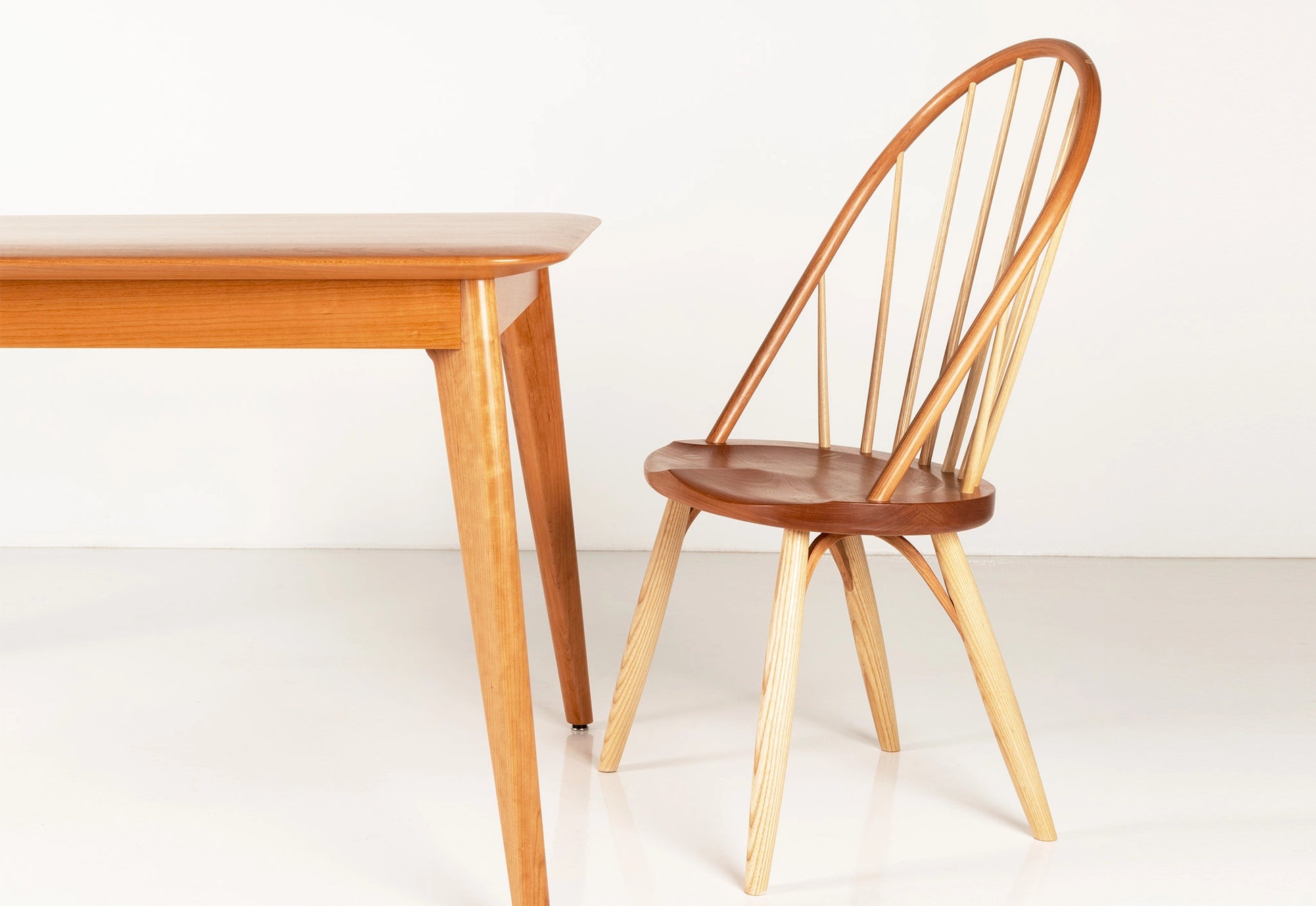 Wooden dining table and chair on a white background