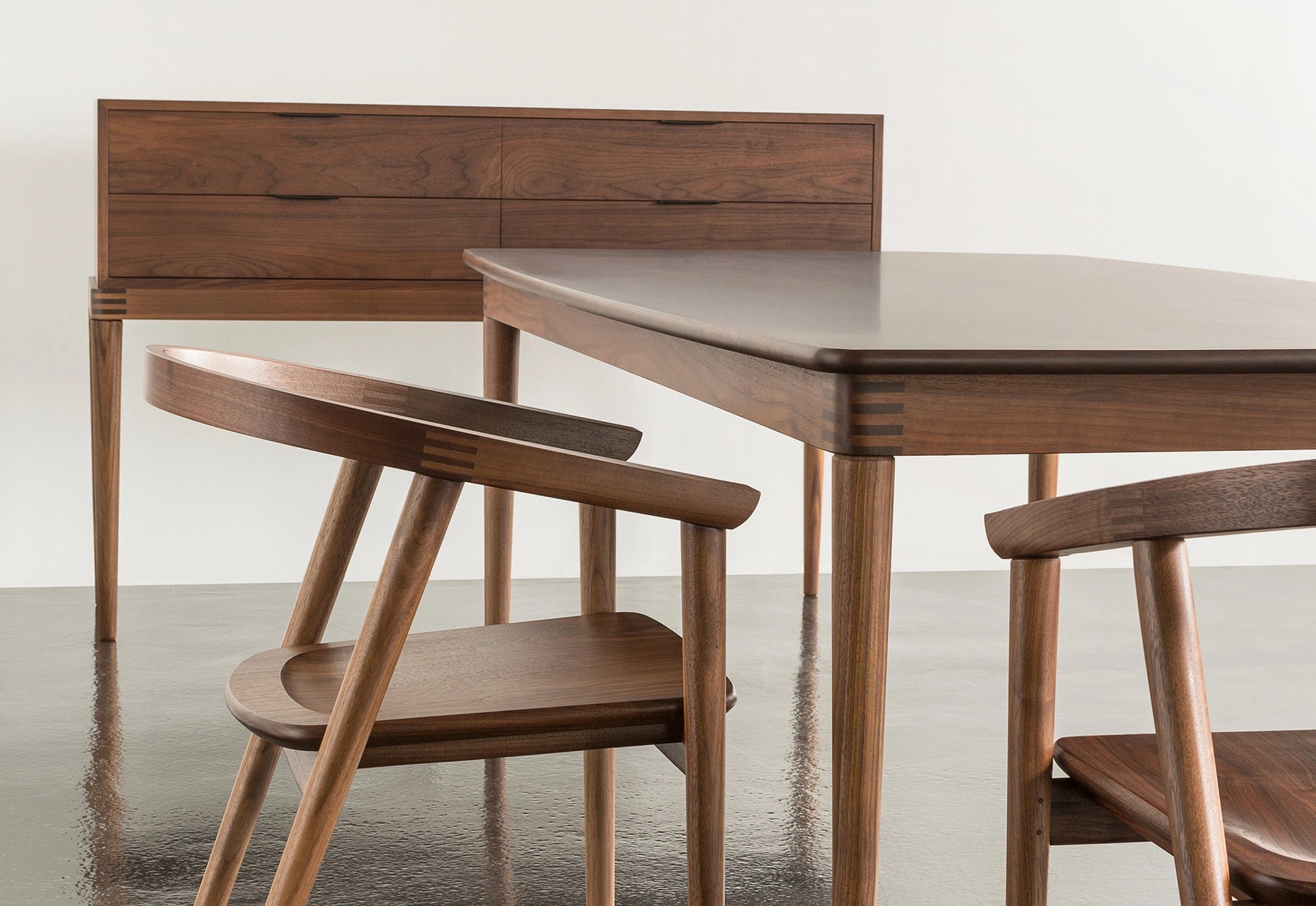 Wooden dining table and chairs in a minimalistic setting