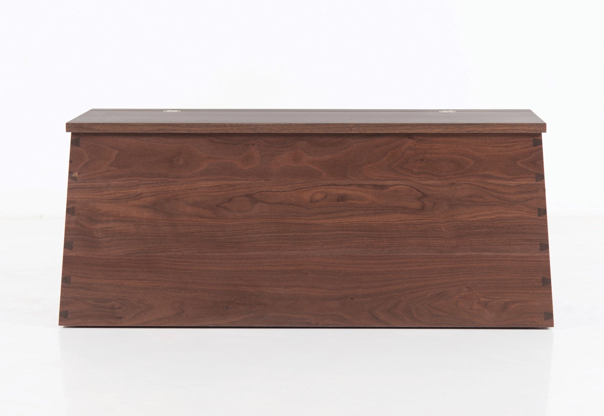 Wooden storage box with a lid on a white background