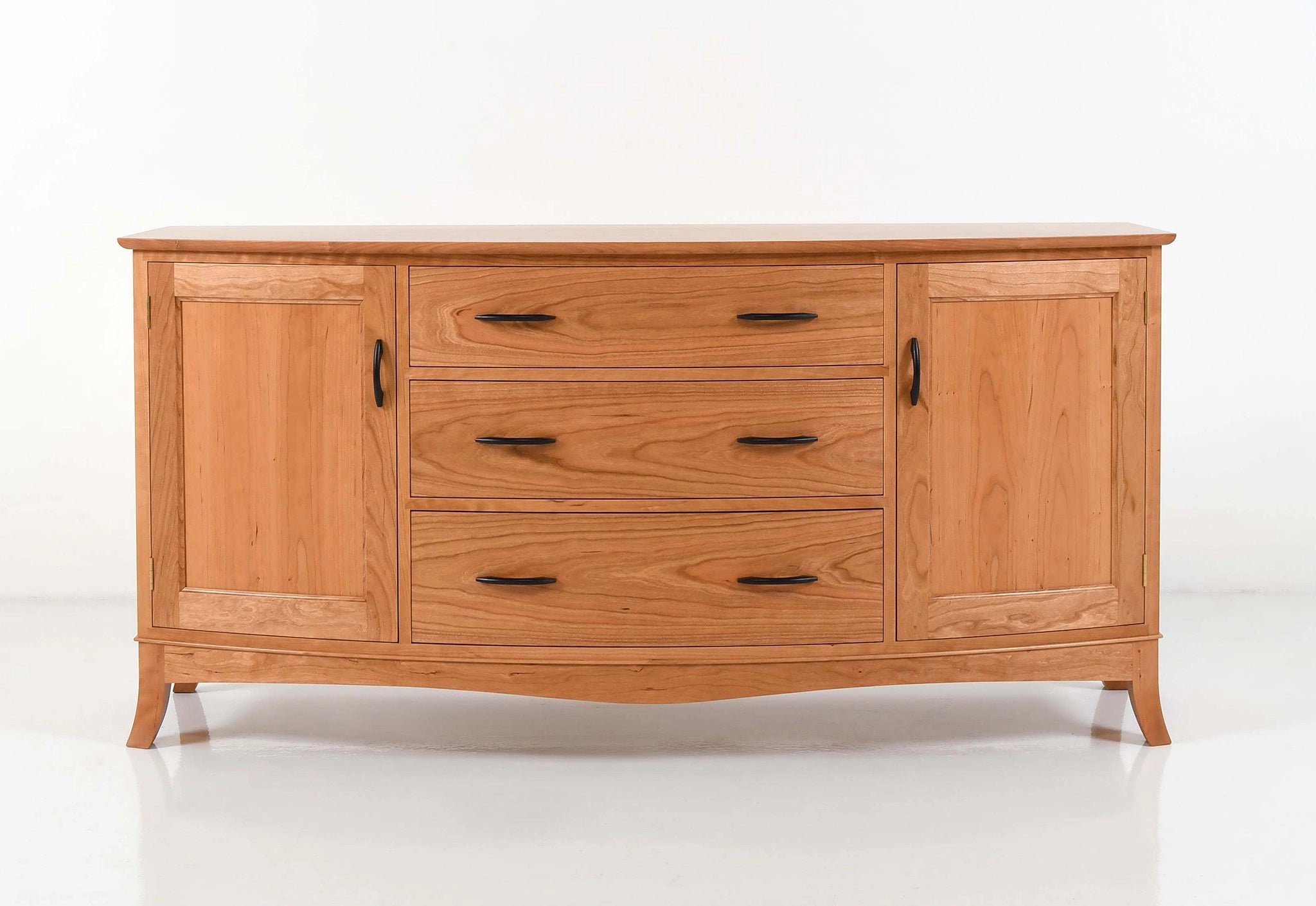Wooden sideboard with multiple drawers and doors on a white background