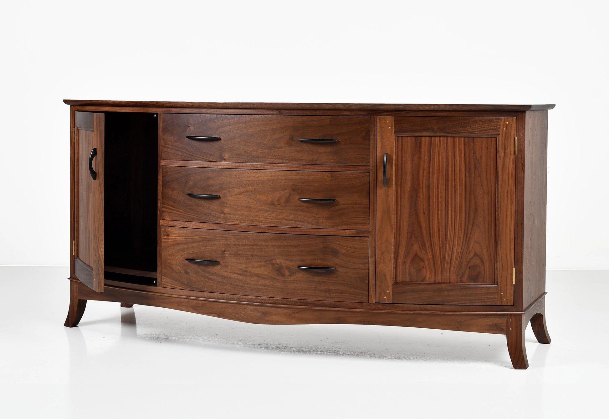 Wooden sideboard with multiple drawers and a cabinet on a white background