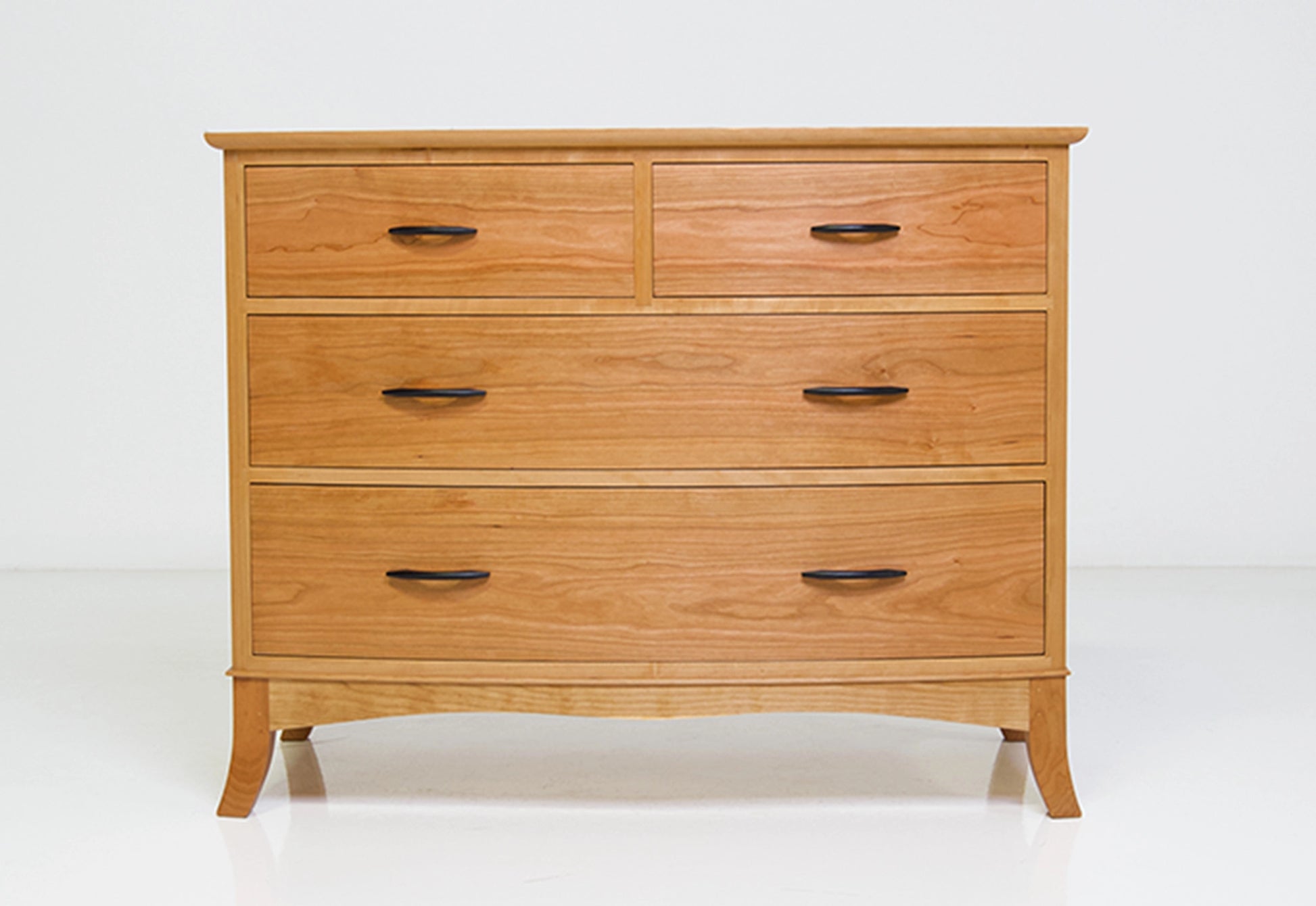 Wooden dresser with multiple drawers on a white background