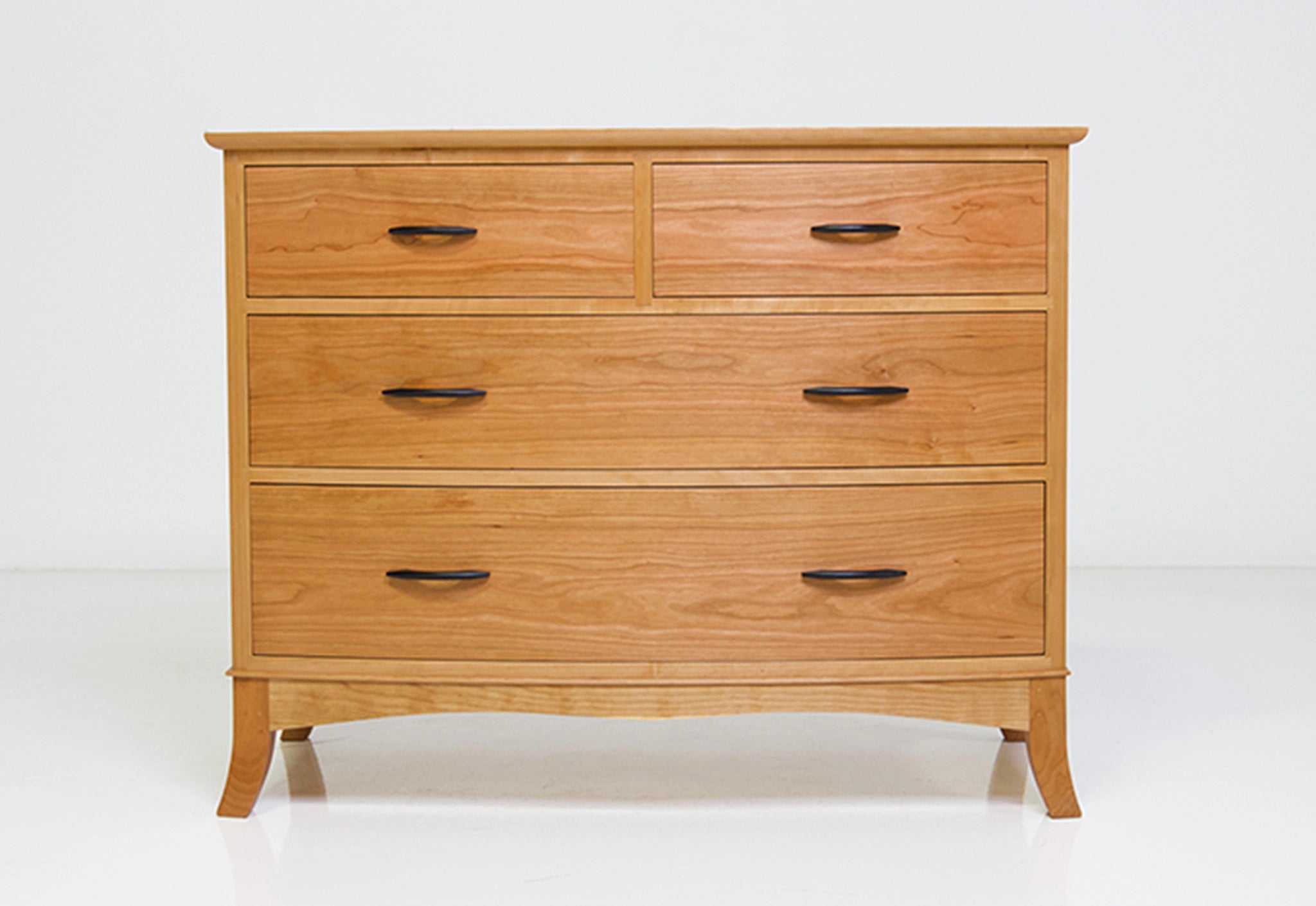 Wooden dresser with multiple drawers on a white background