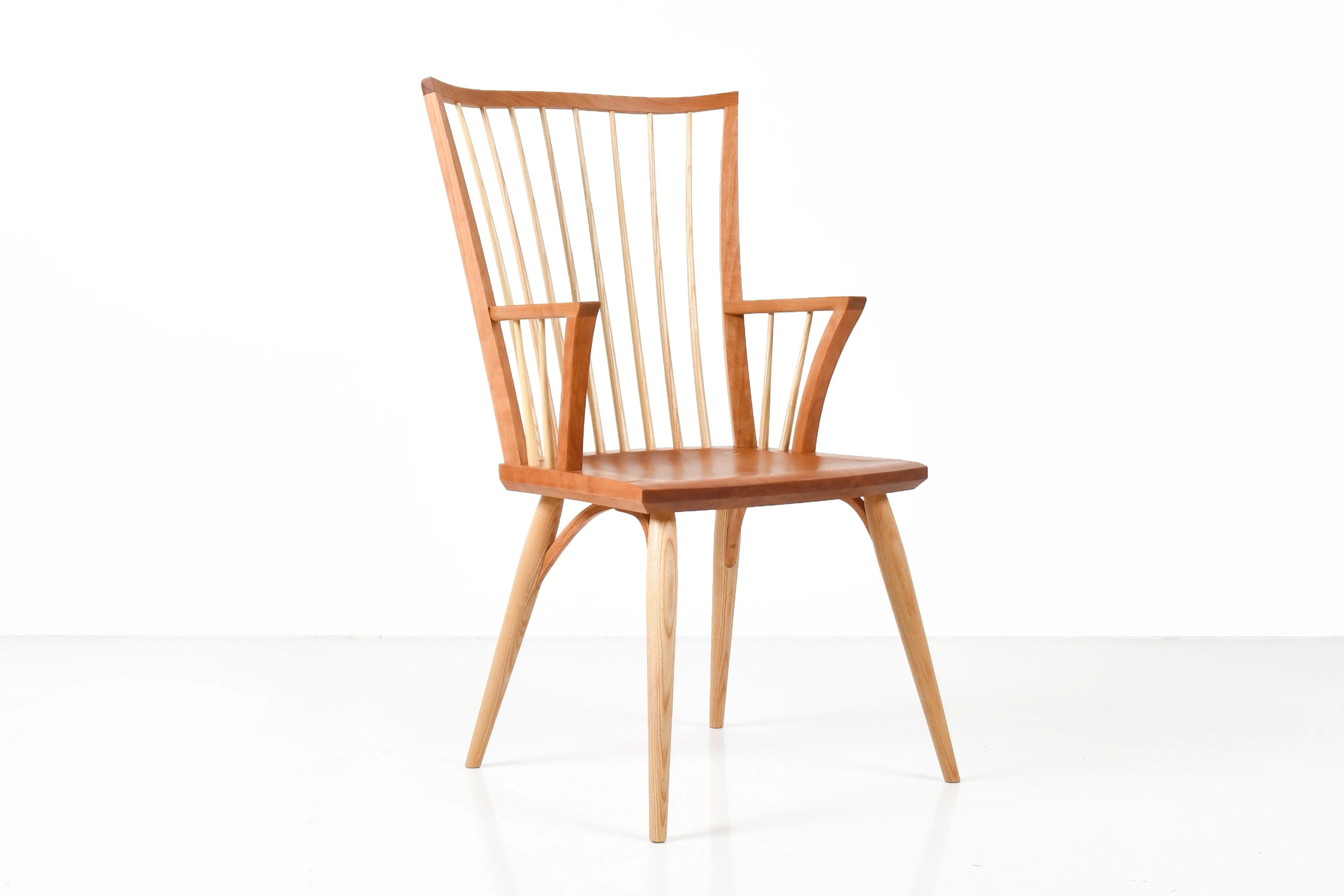Cherry wood chair on a white background.
