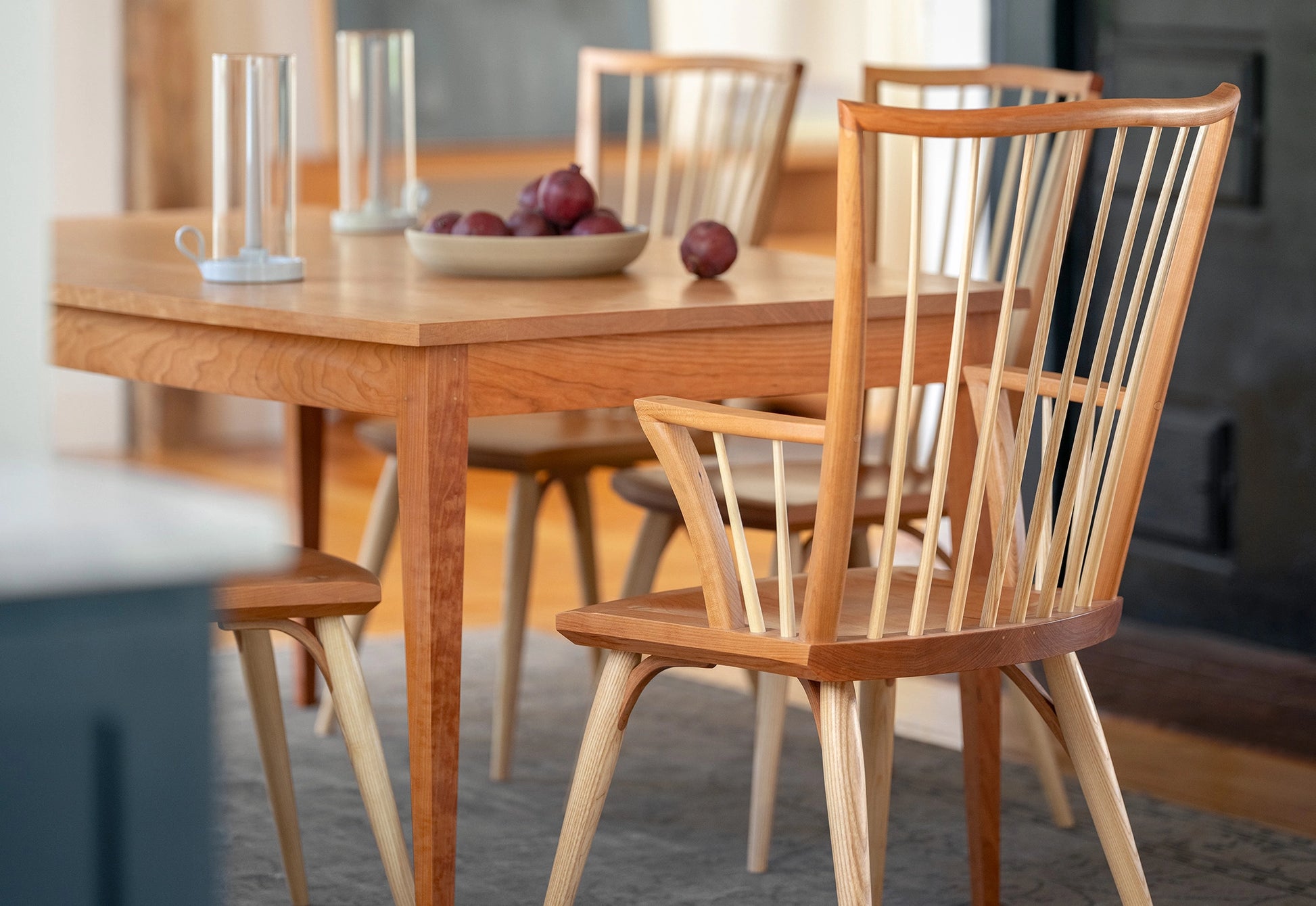 Wooden dining table with chairs in a room setting