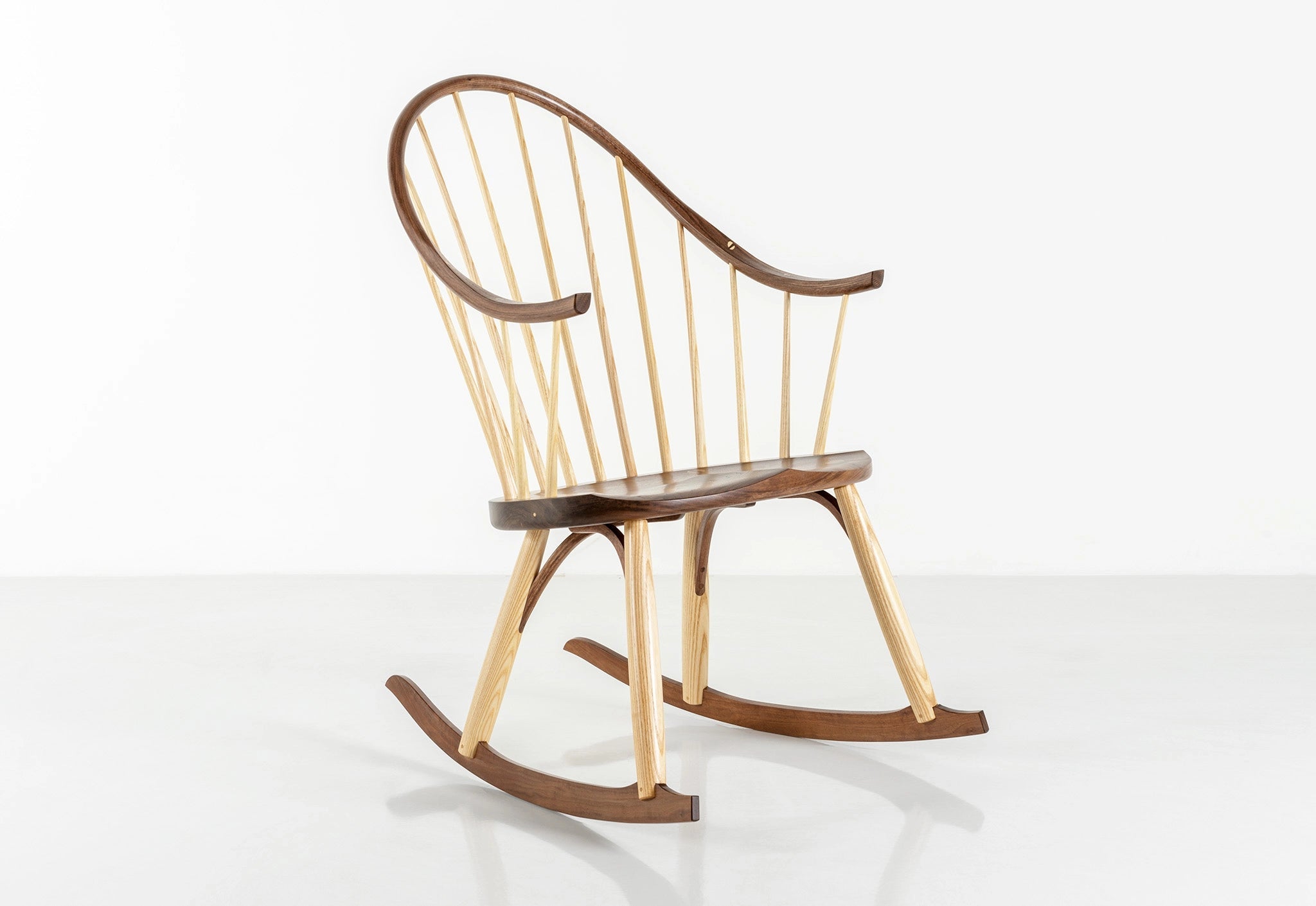 Wooden rocking chair with a white background