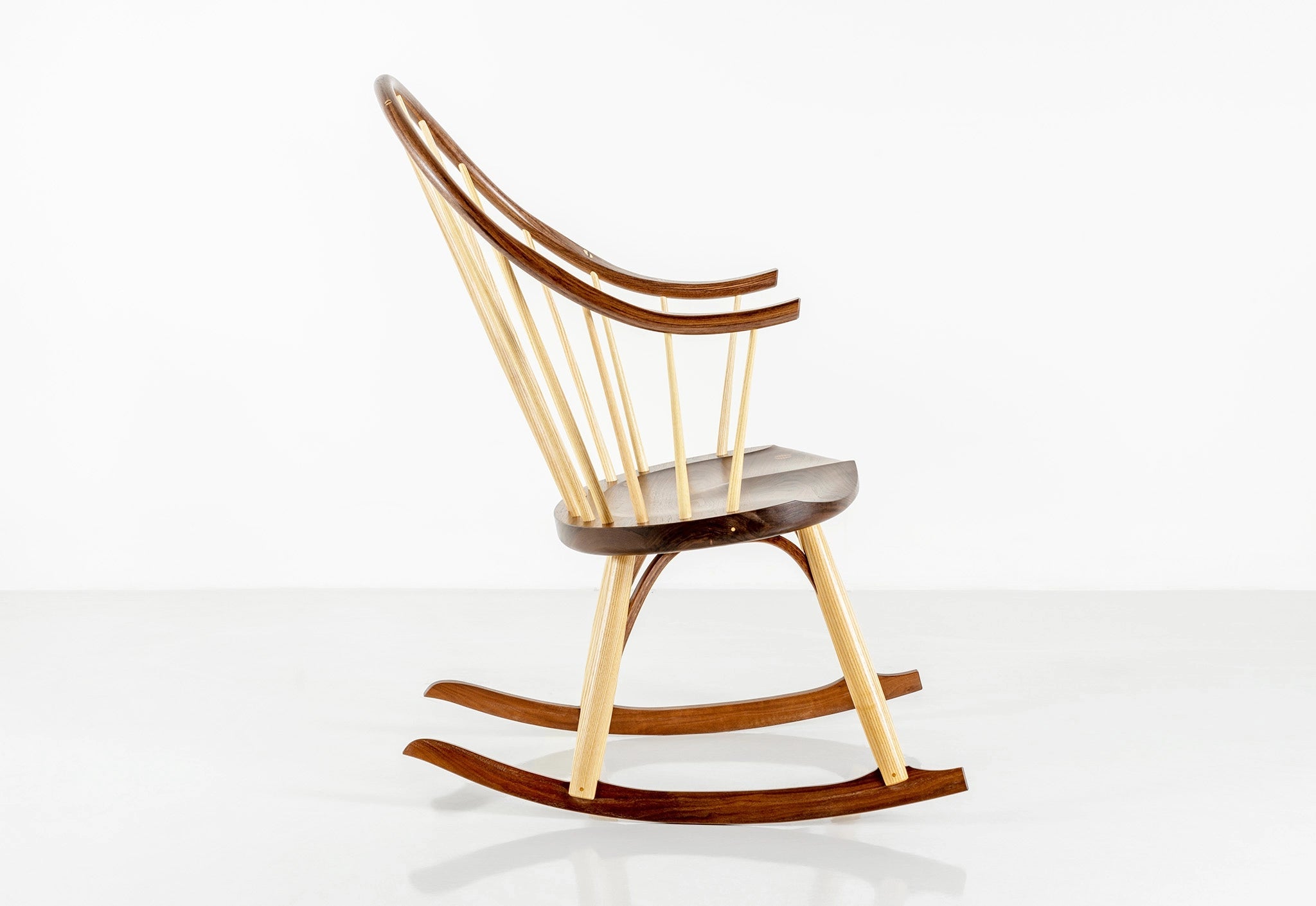 Wooden rocking chair with a white background
