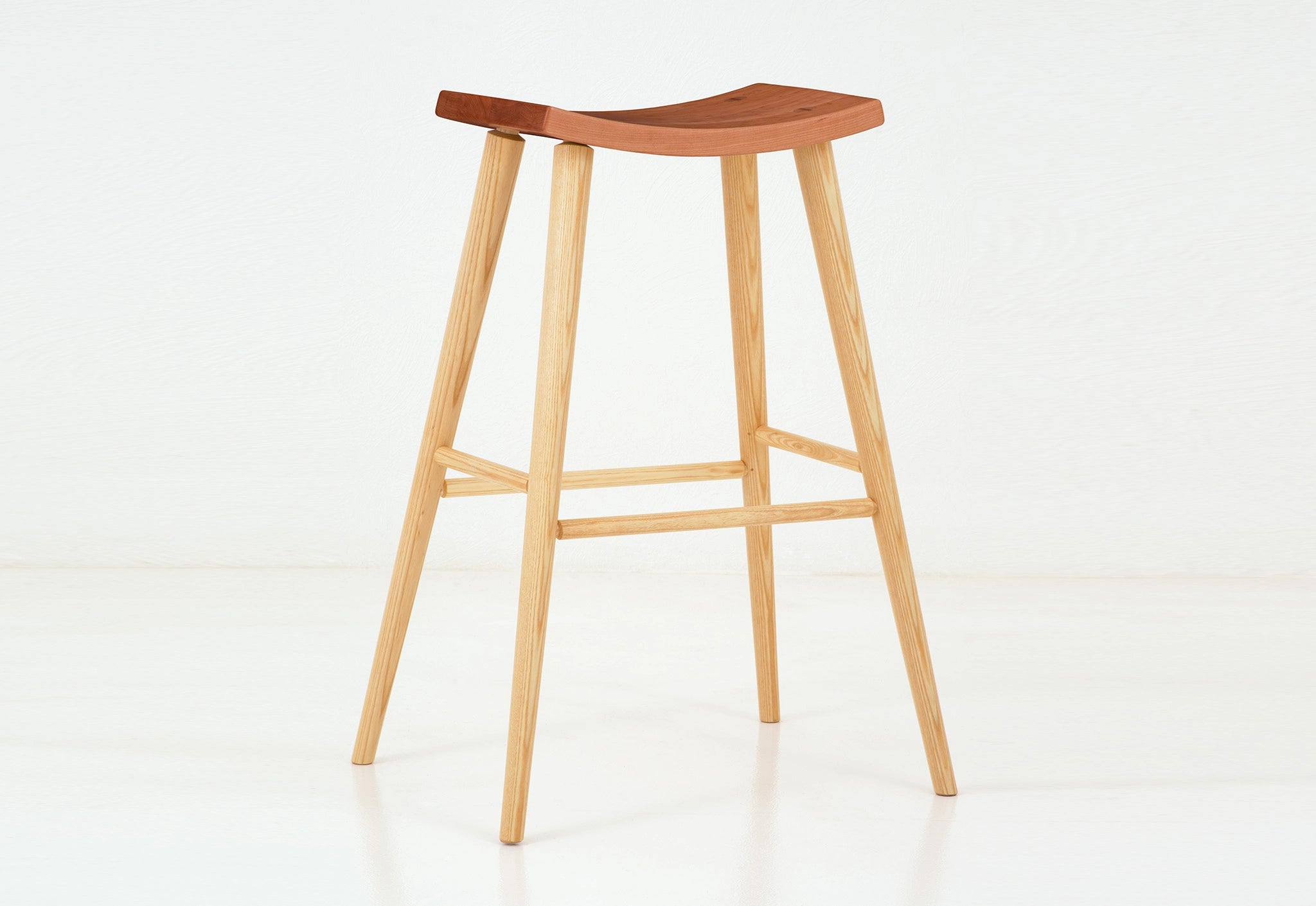 Wooden bar stool with a white background