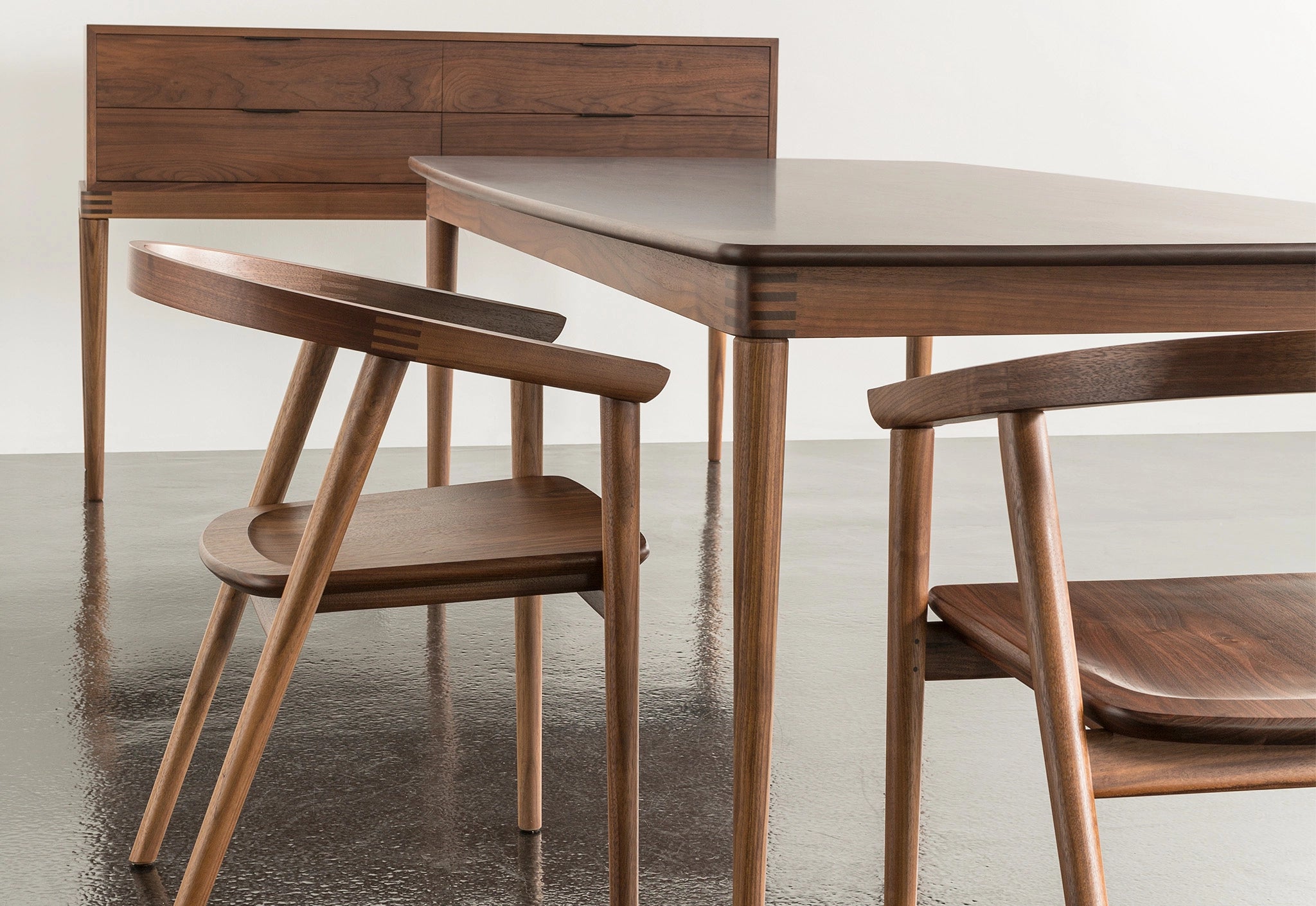 Wooden dining table and chairs in a minimalistic setting