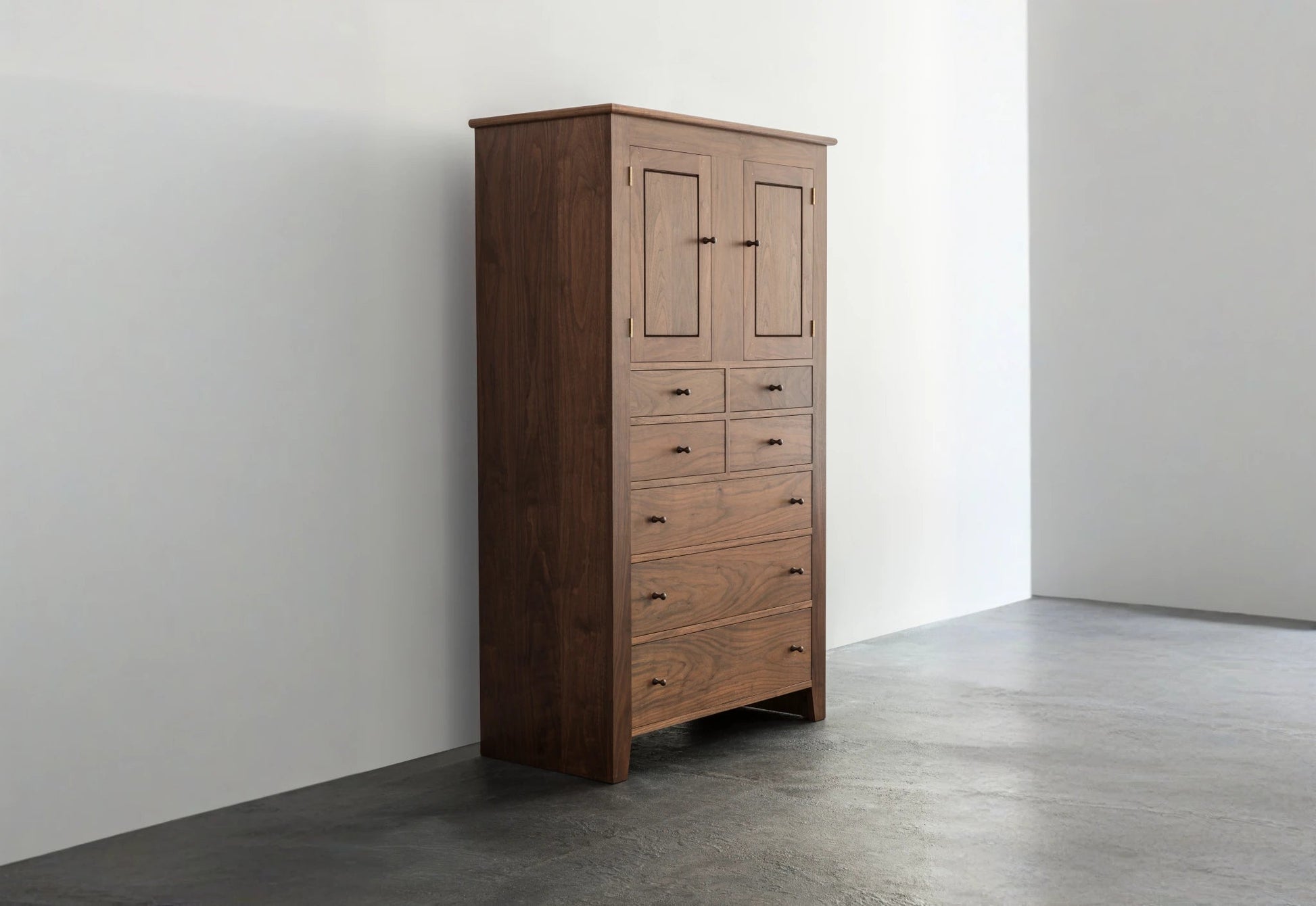 Wooden wardrobe against a white wall