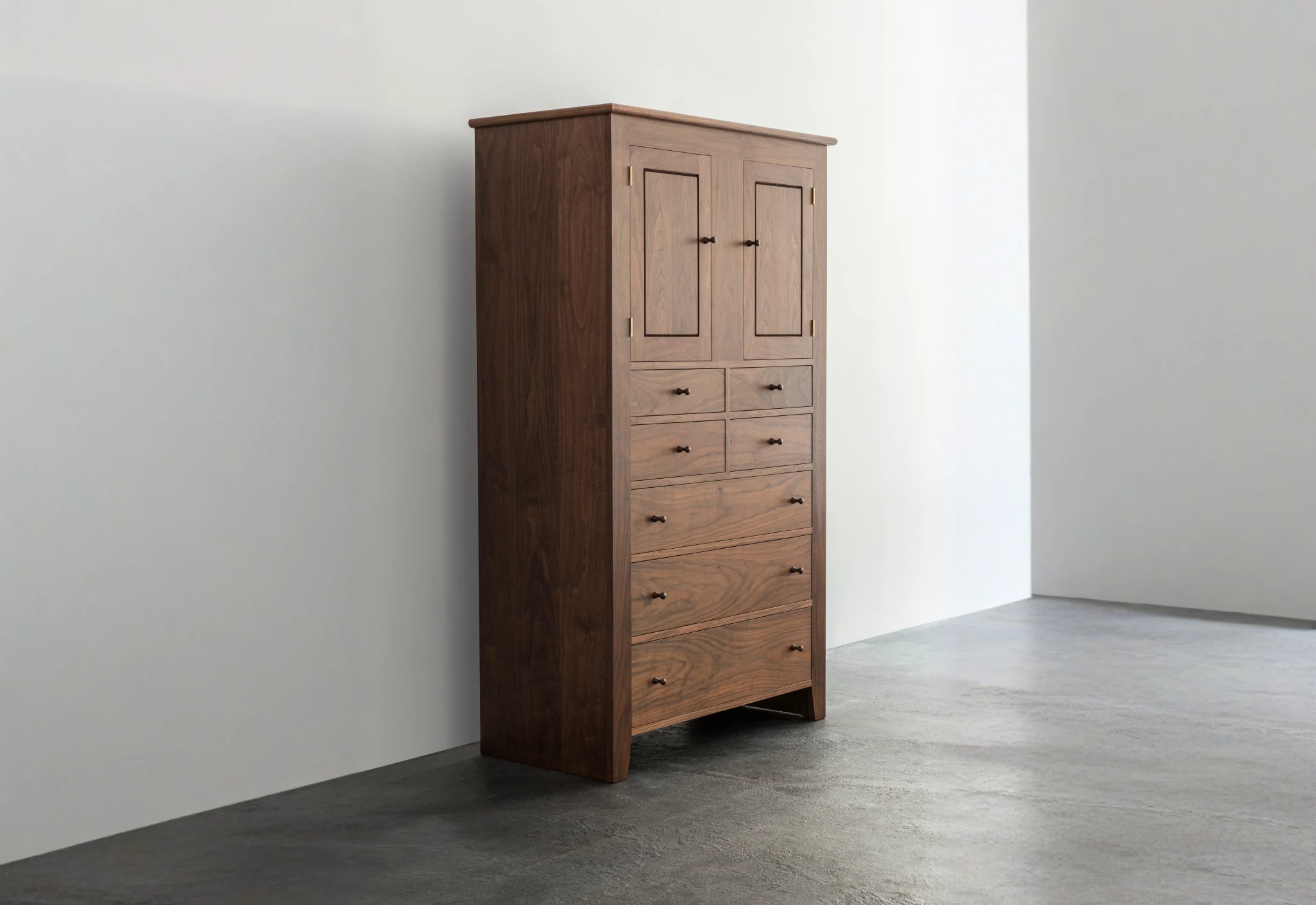 Wooden wardrobe against a white wall