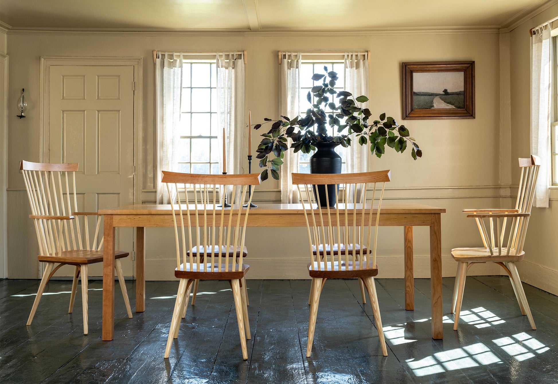 Shaker style dining room with green floor and yellow walls.