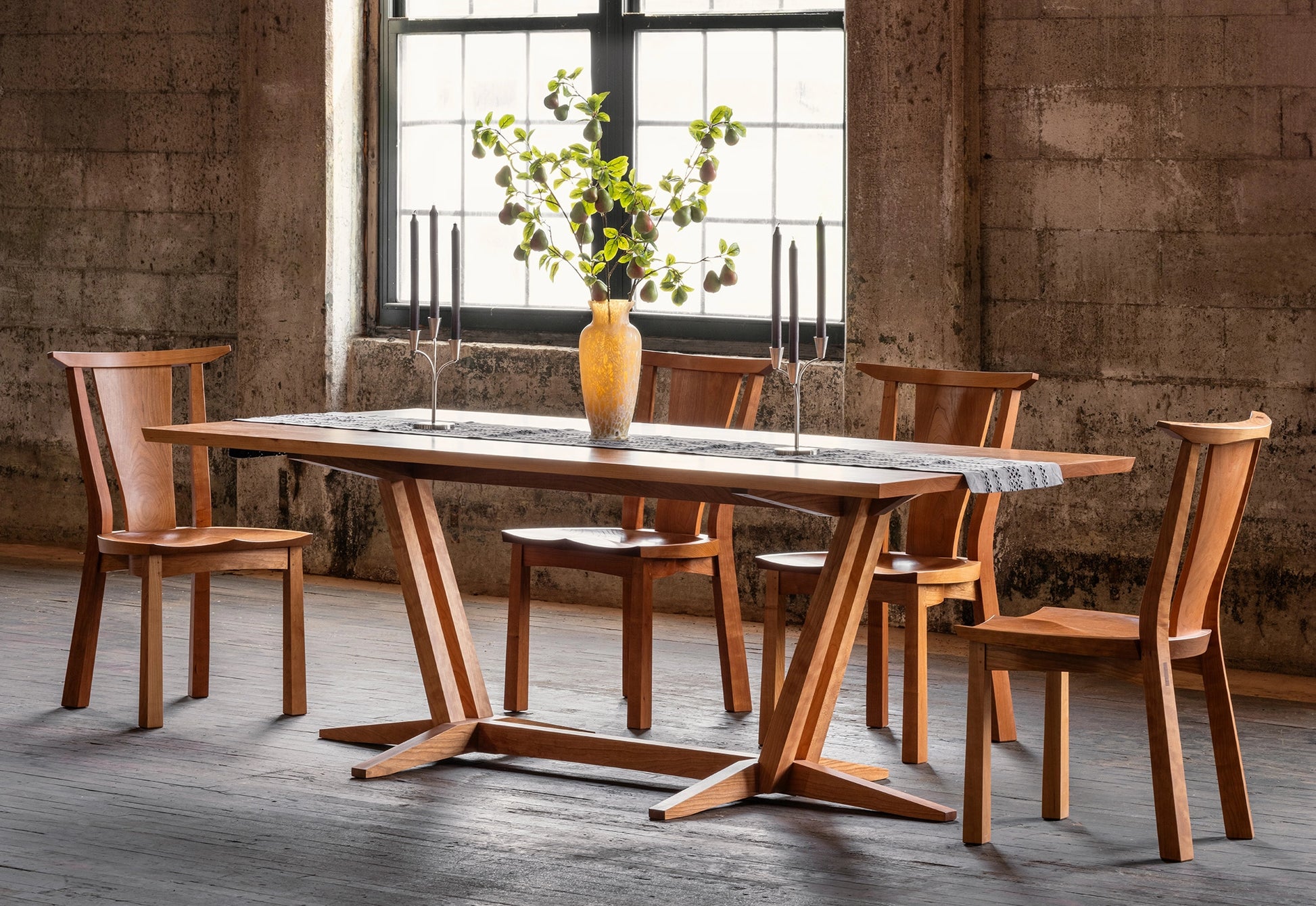 Wooden dining table with chairs in a rustic setting