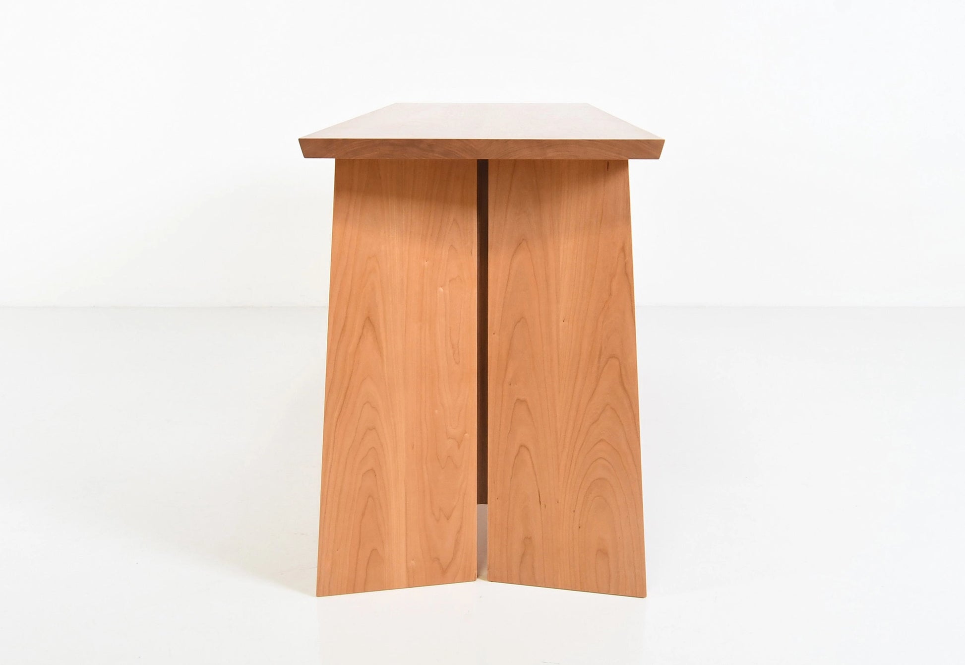 Wooden sideboard with three drawers on a white background