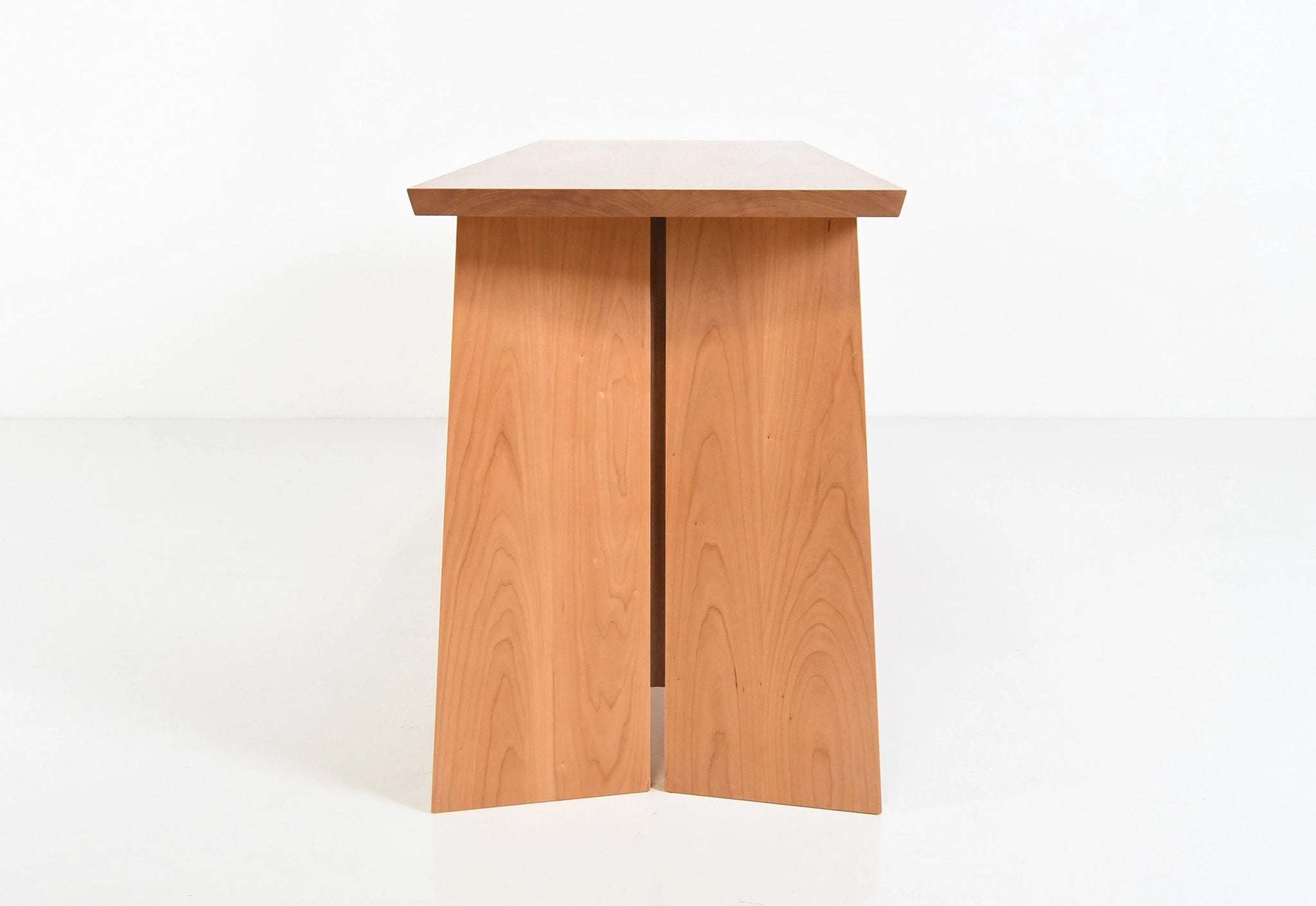Wooden sideboard with three drawers on a white background