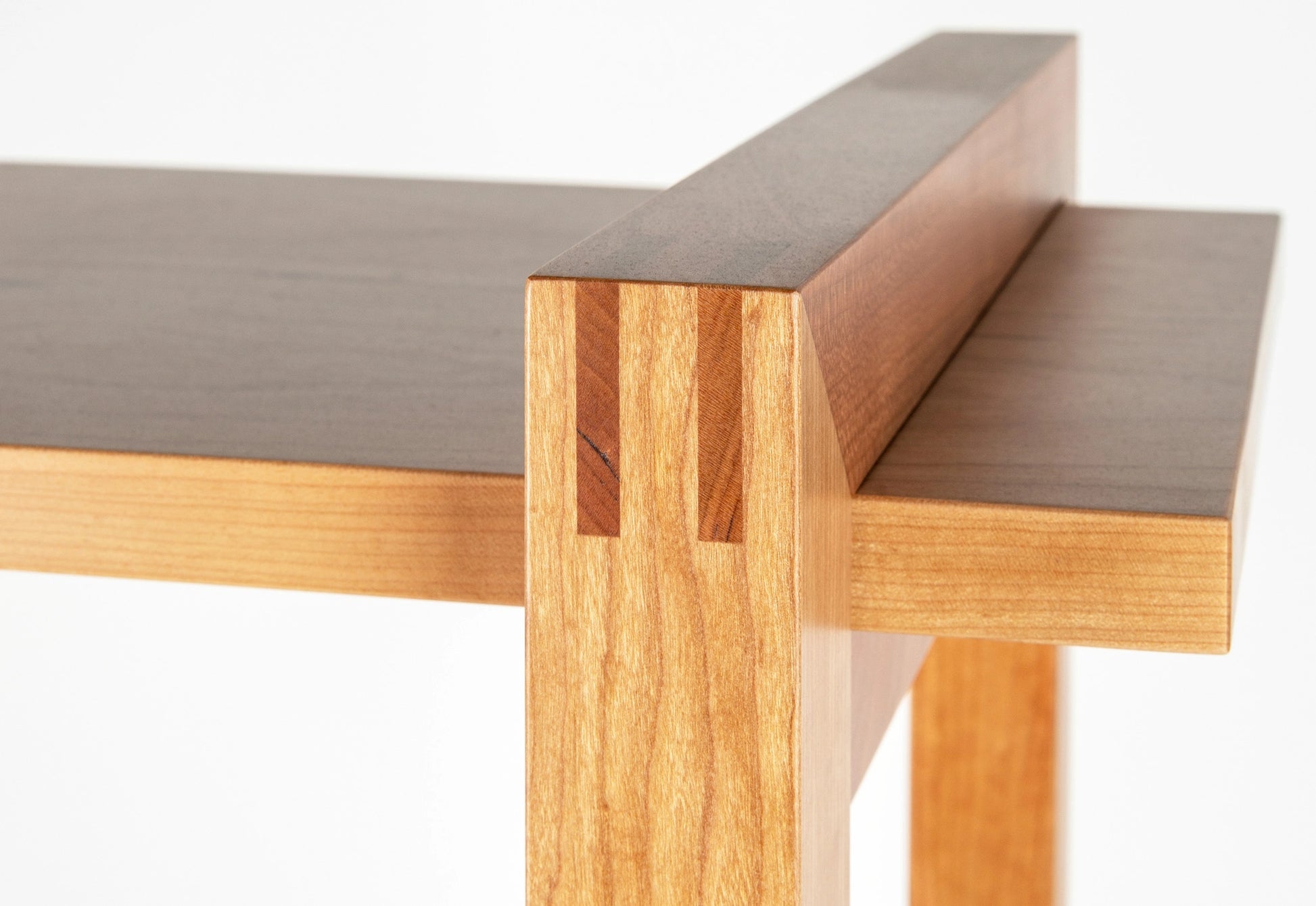 Wooden bookshelf detail on a white background