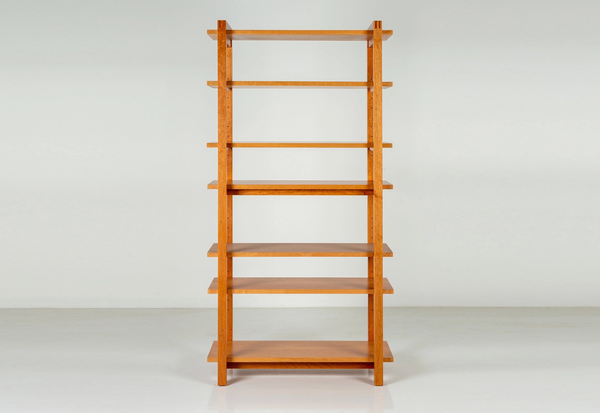 Wooden bookshelf on a white background