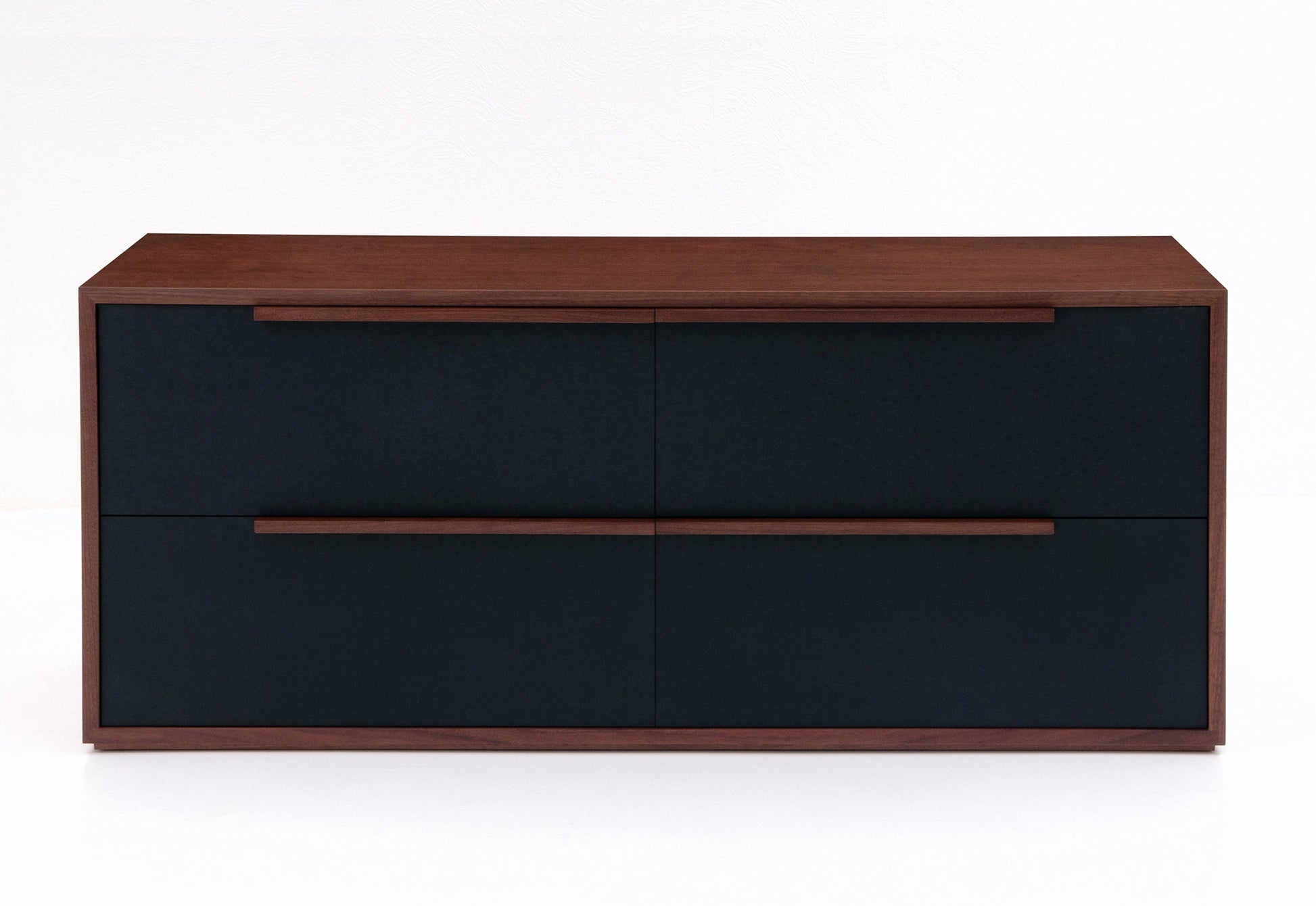 Wooden file case with black leather-faced drawers on a white background