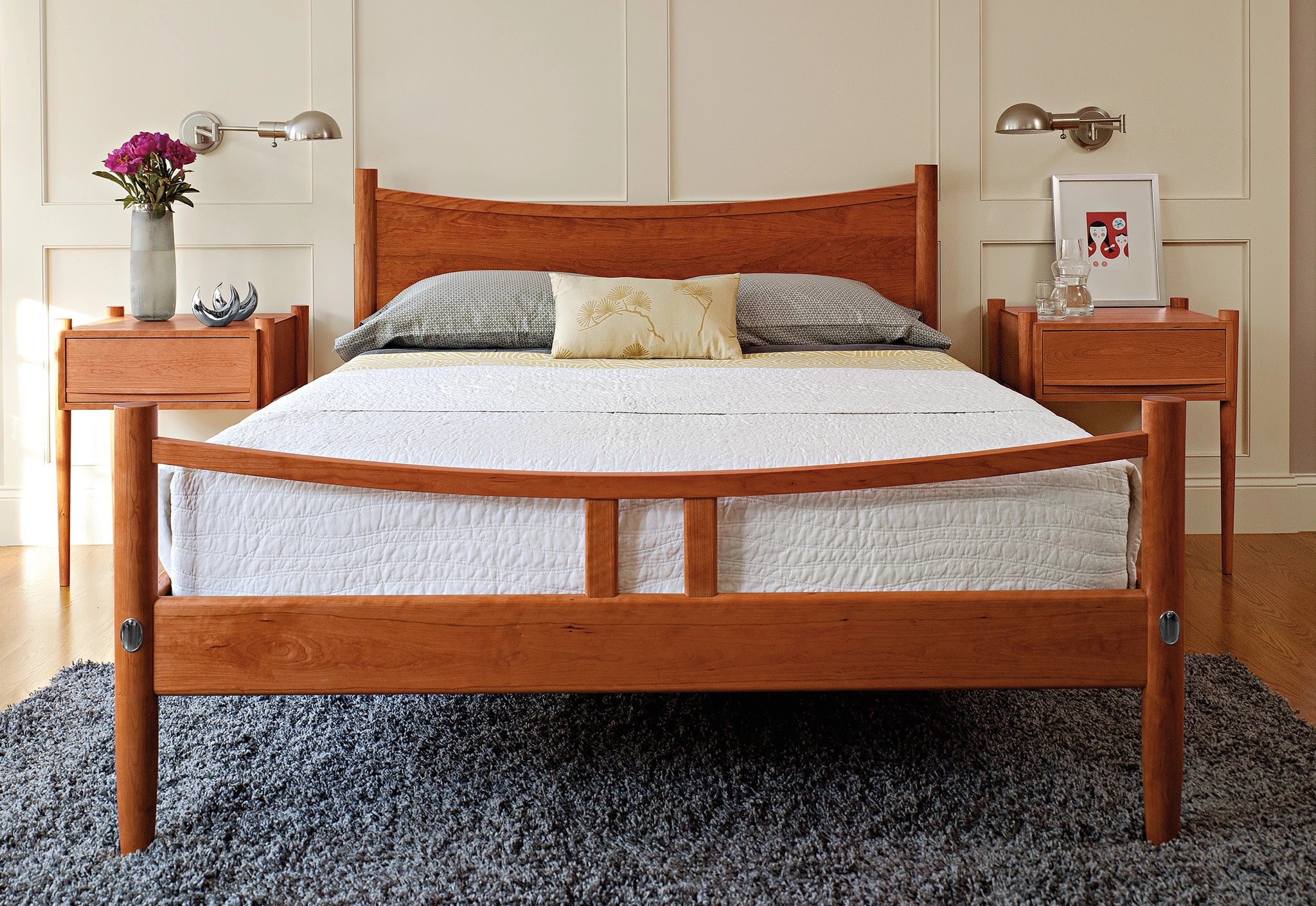 Wooden bed frame with mattress in a bedroom setting