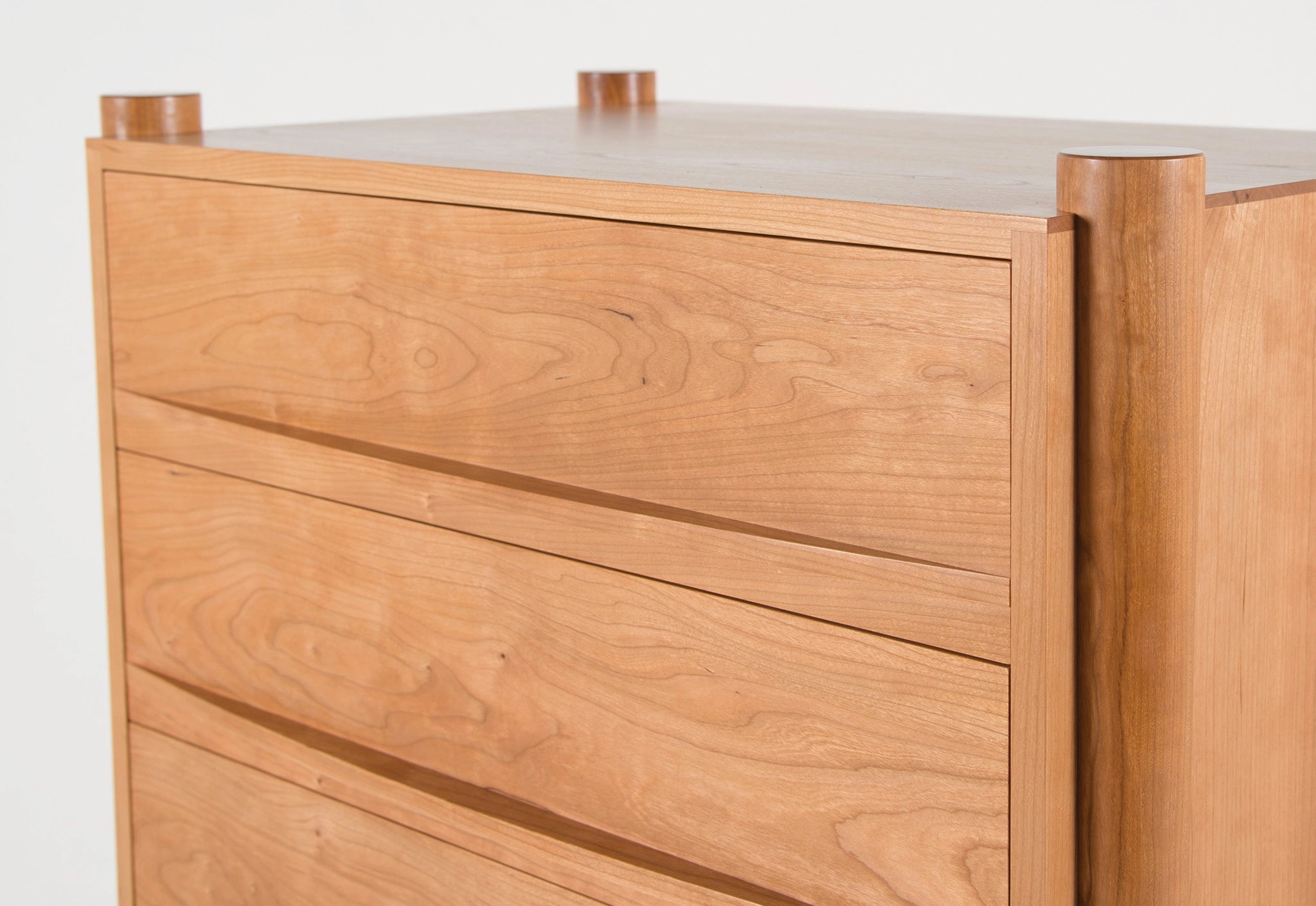 Wooden dresser with drawers on a white background