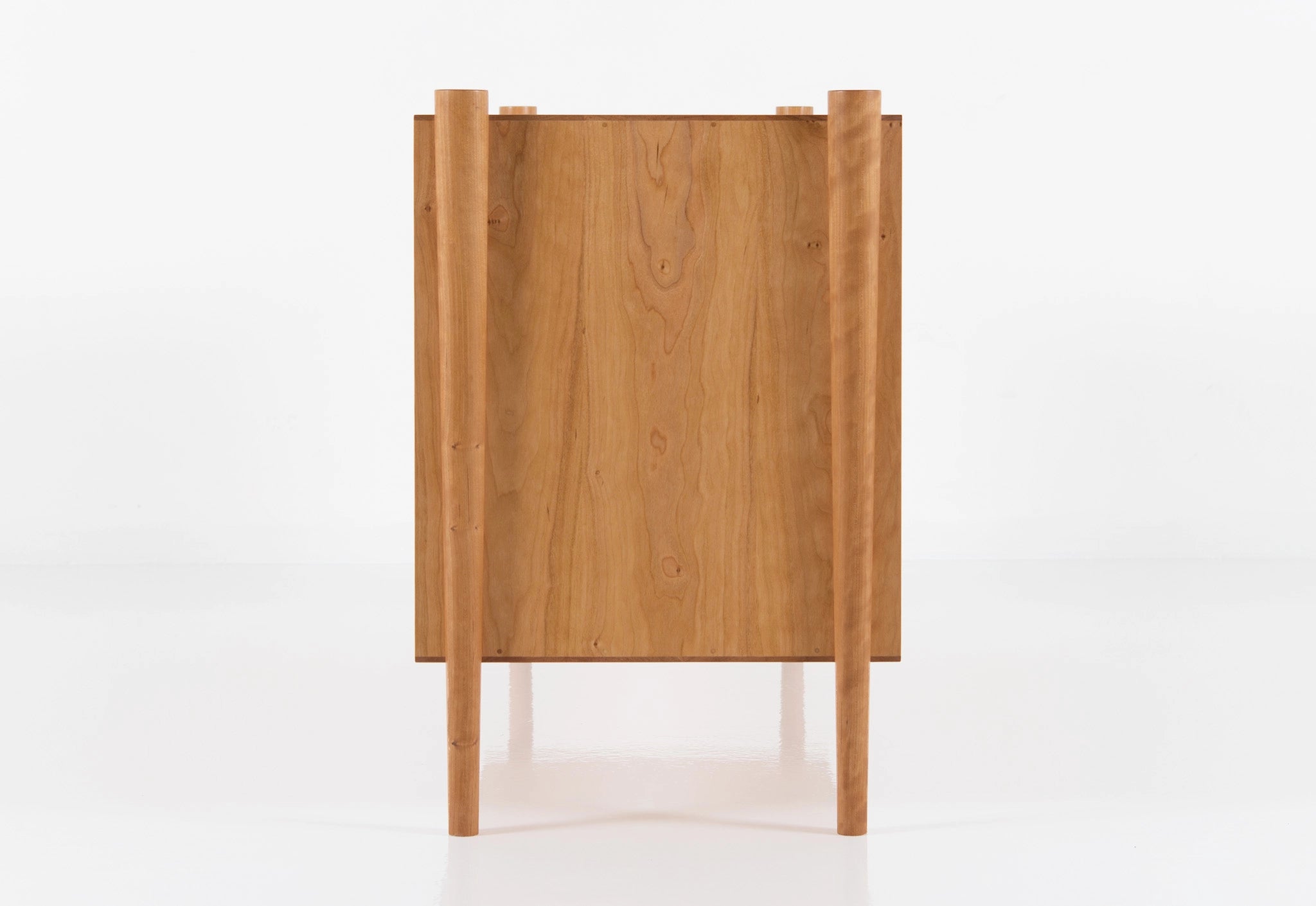 Wooden cabinet with a minimalist design on a white background