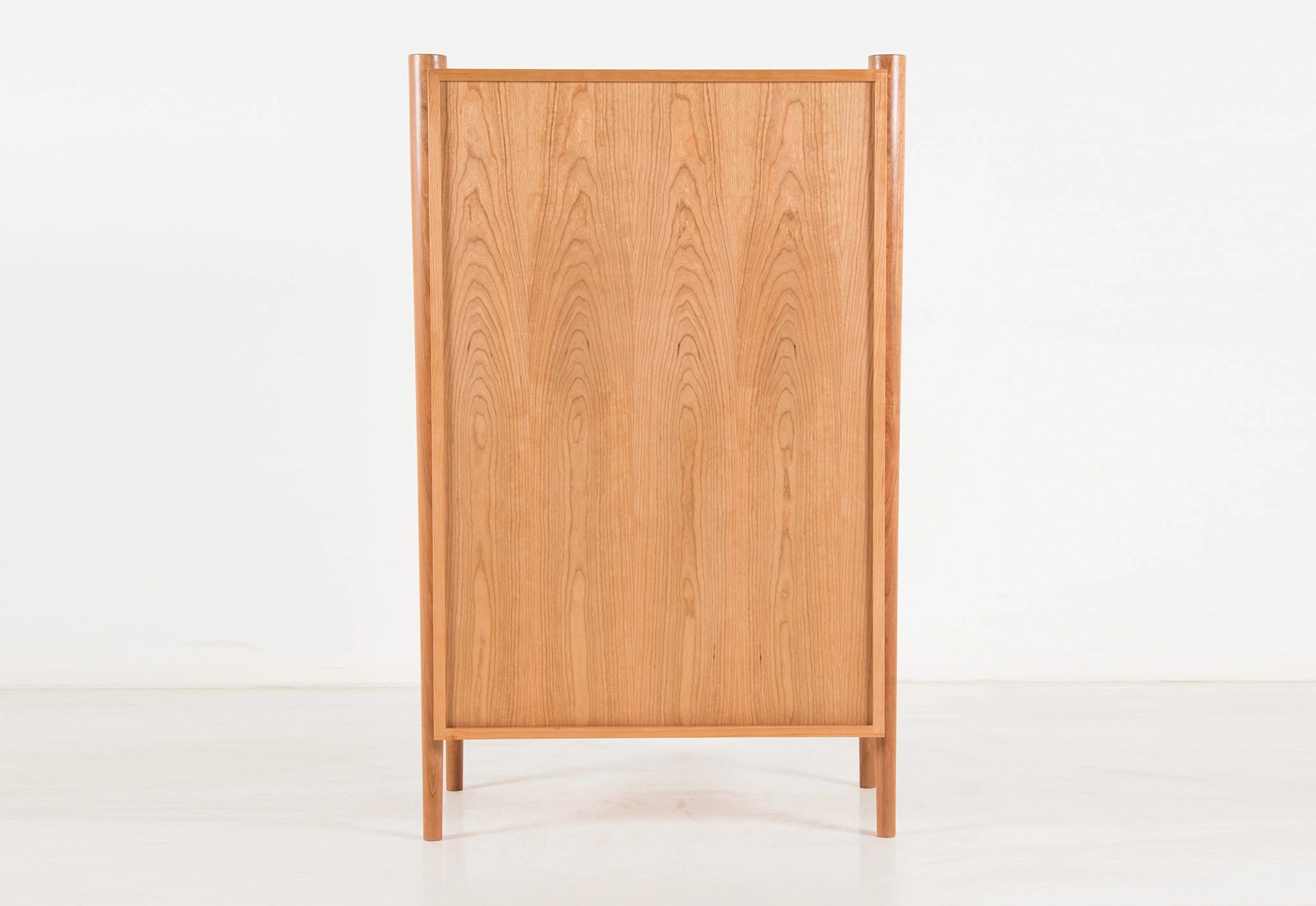 Wooden cabinet with a grid pattern on a white background