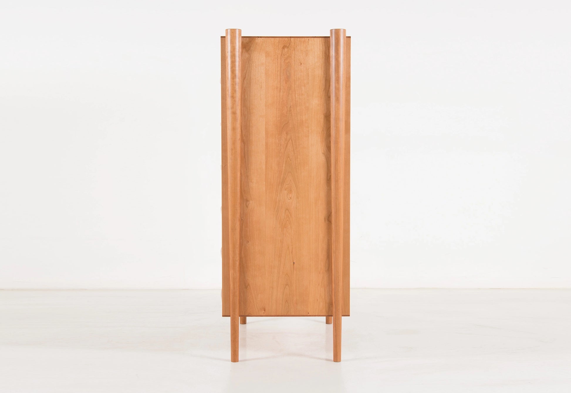Wooden cabinet with a minimalist design on a white background