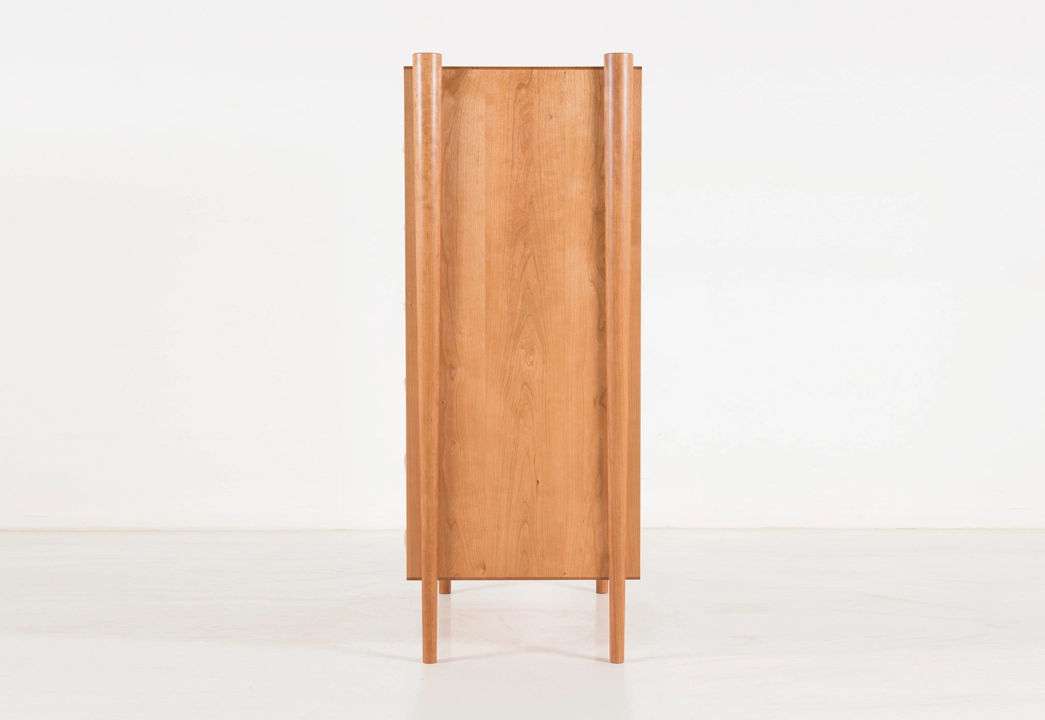 Wooden cabinet with a minimalist design on a white background