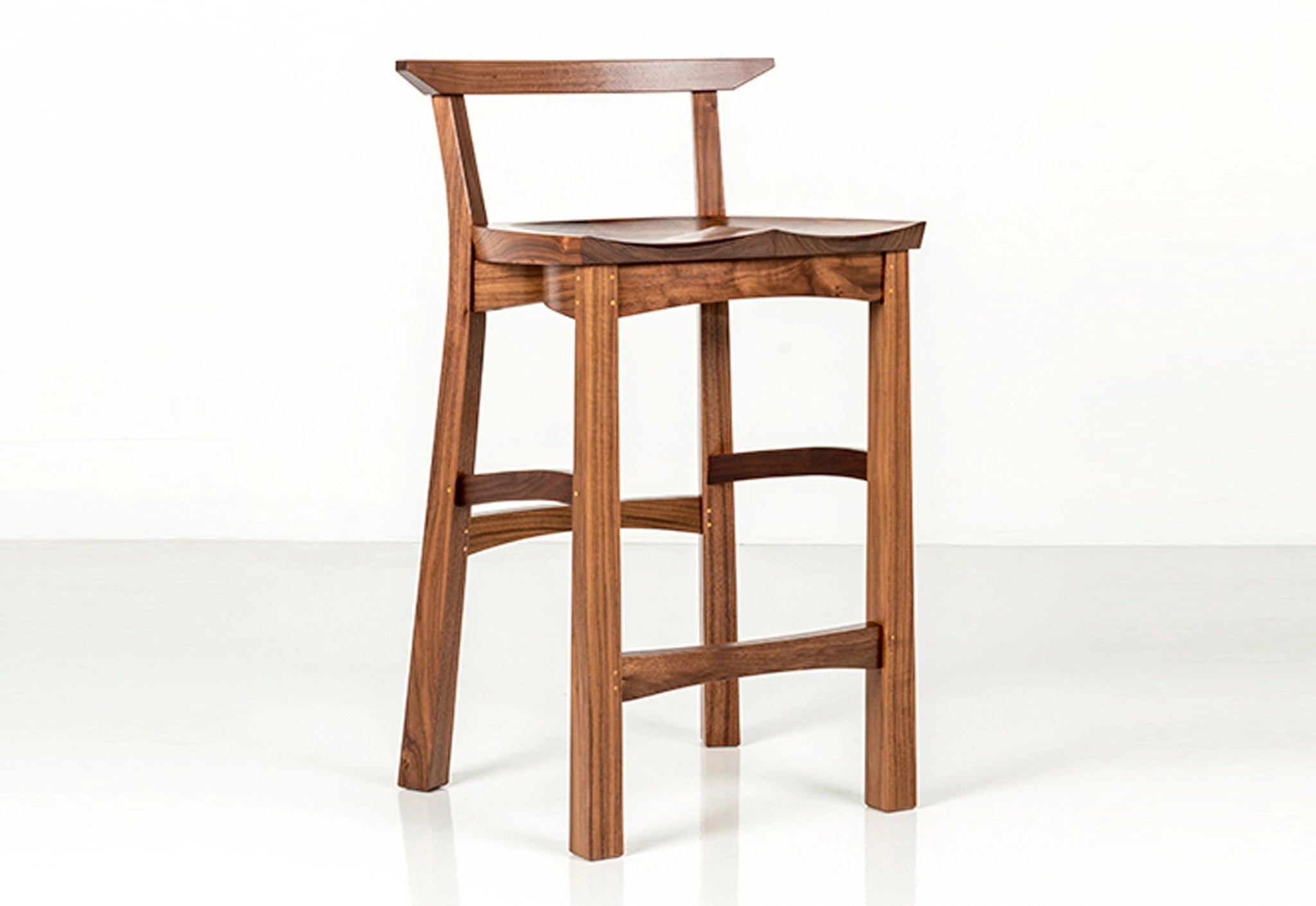 Wooden bar stool on a white background