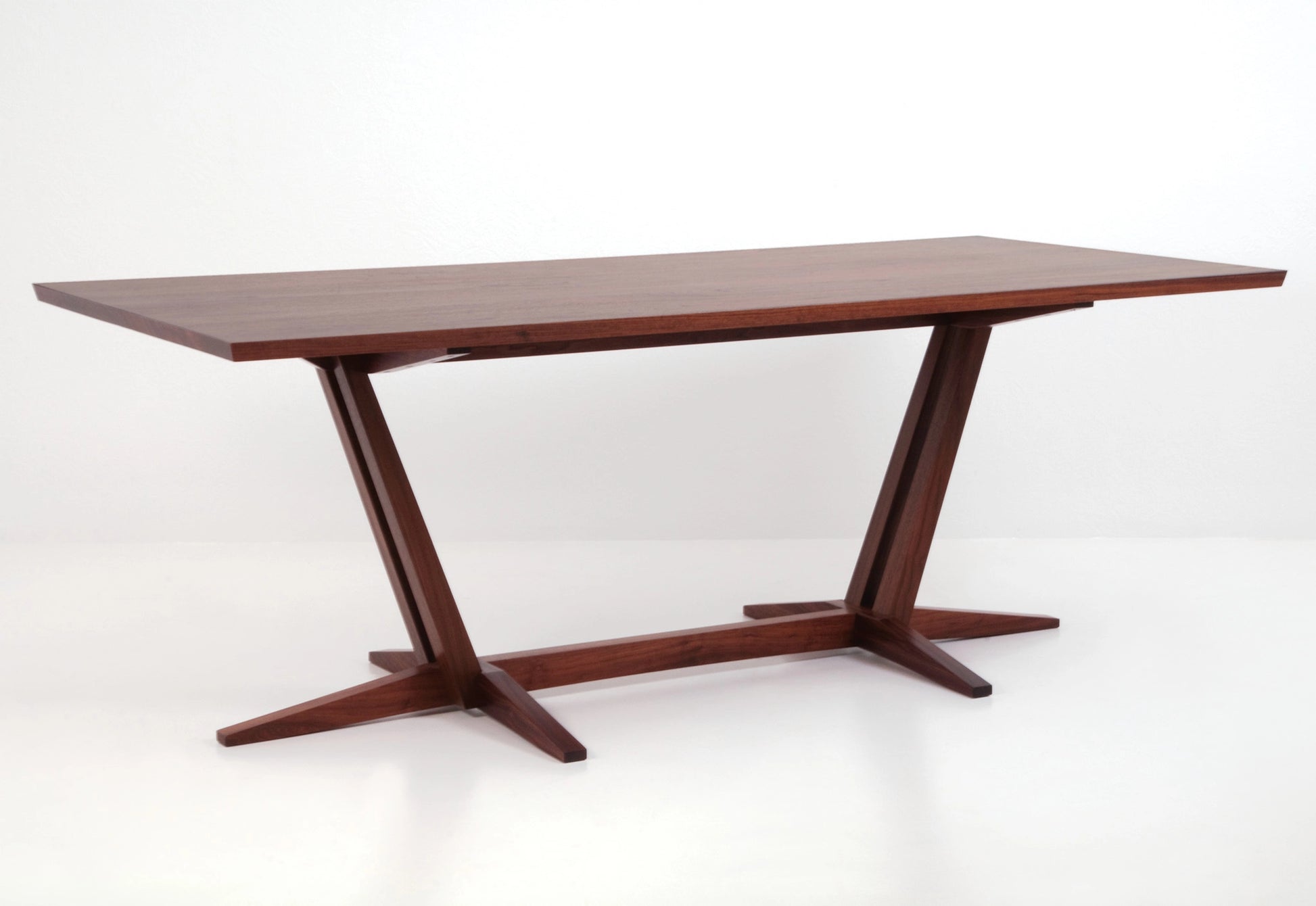 Wooden dining table with a white background