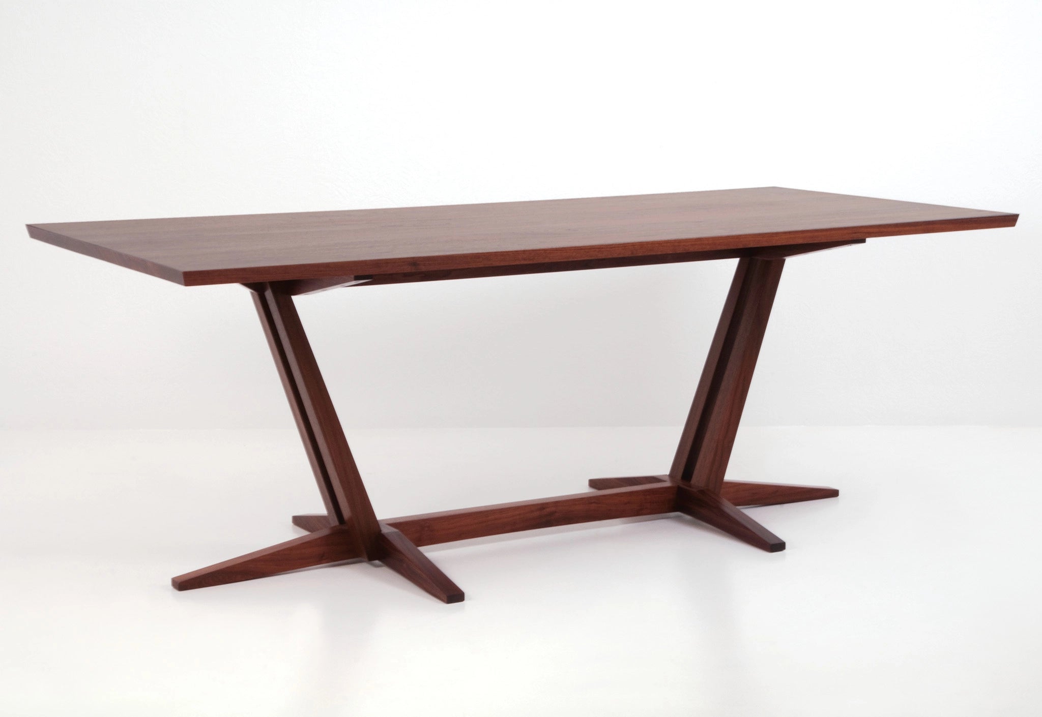 Wooden dining table with a white background