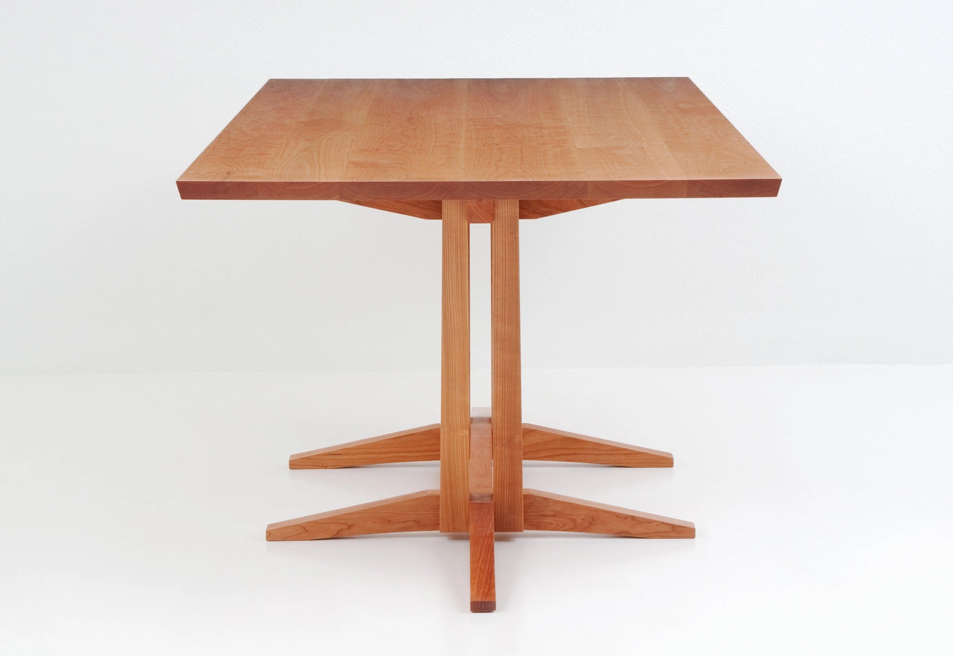 Wooden table with a white background